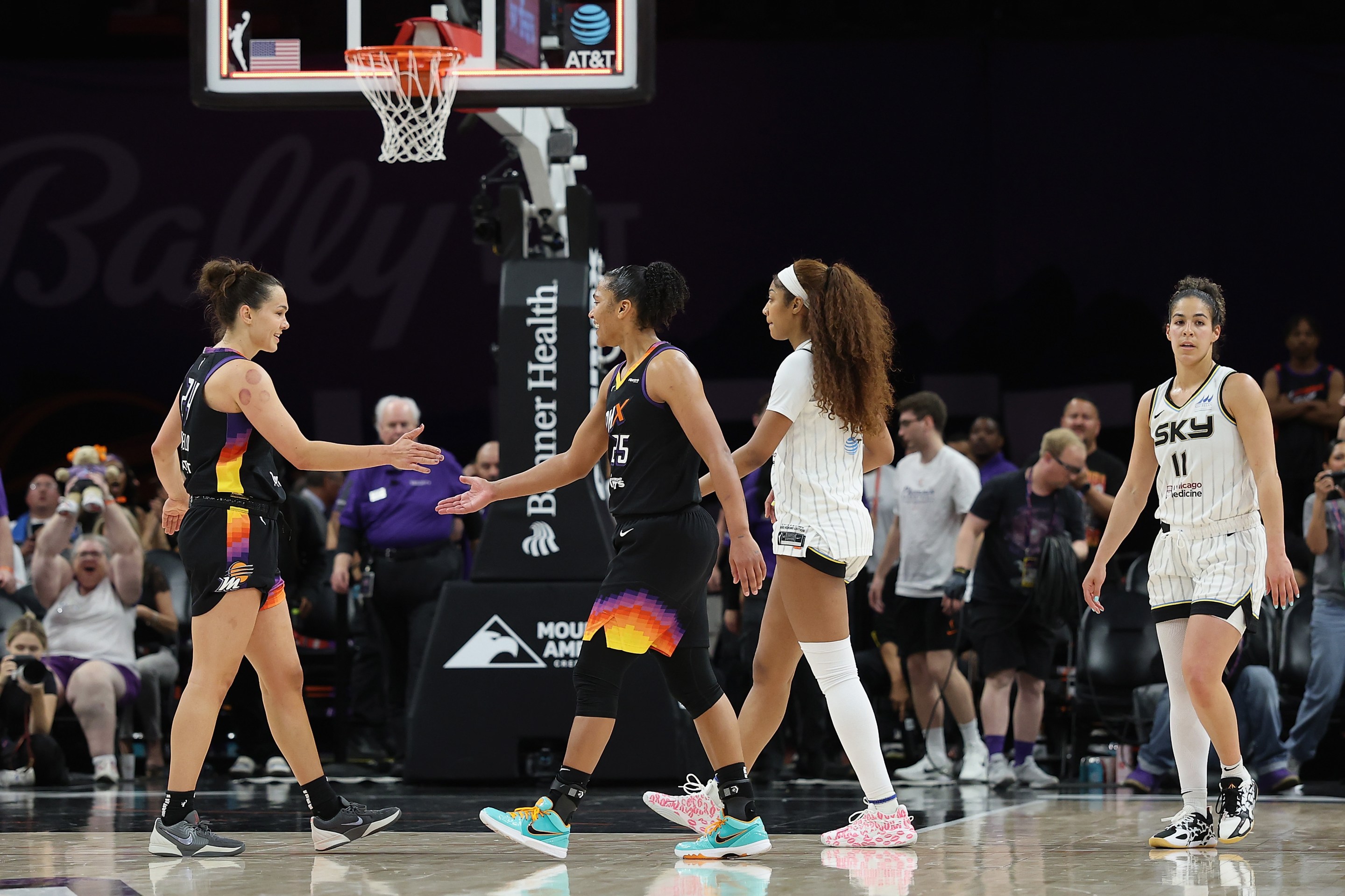 Kathryn Westbeld #24 (L) of the Phoenix Mercury celebrates with Alyssa Thomas #25 after defeating the Chicago Sky 94-89 in the WNBA game at PHX Arena on May 27, 2025 in Phoenix, Arizona.