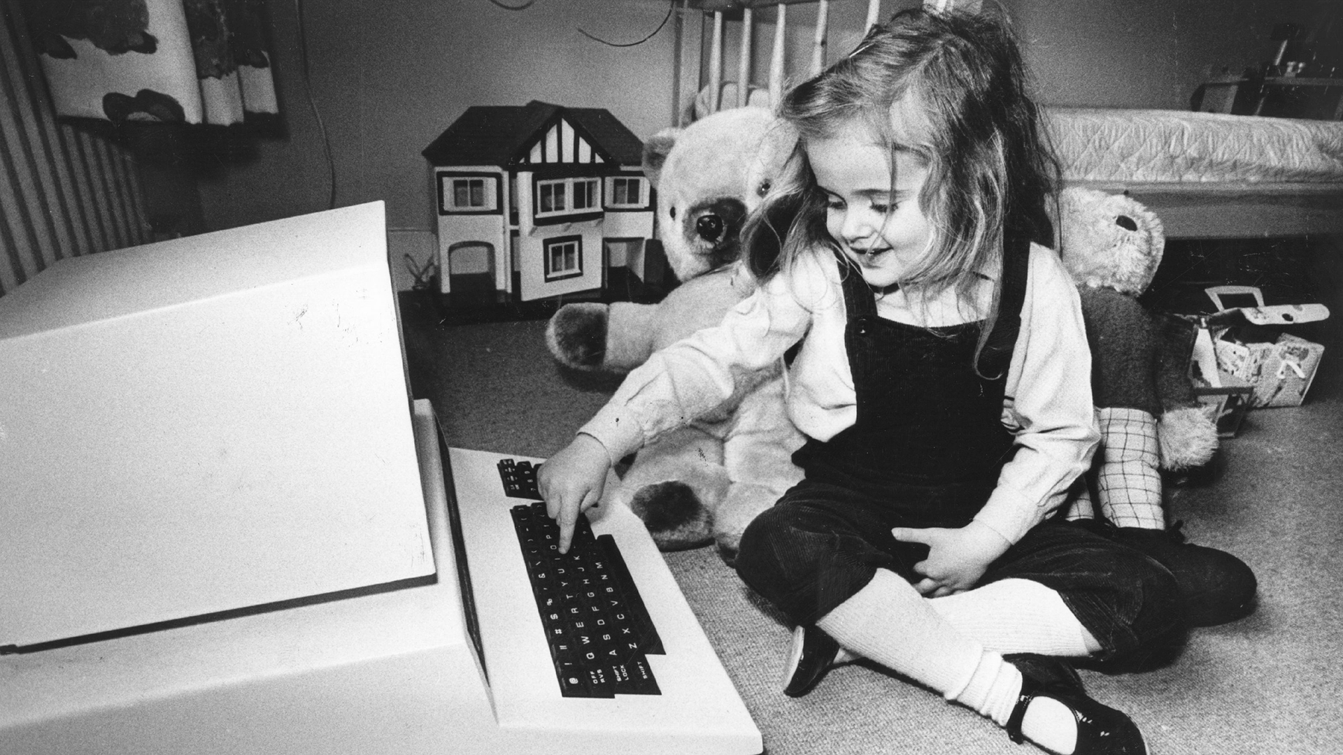 Four-year-old Antonia Salmon with one of her birthday presents,a computer which used to belong to her father.