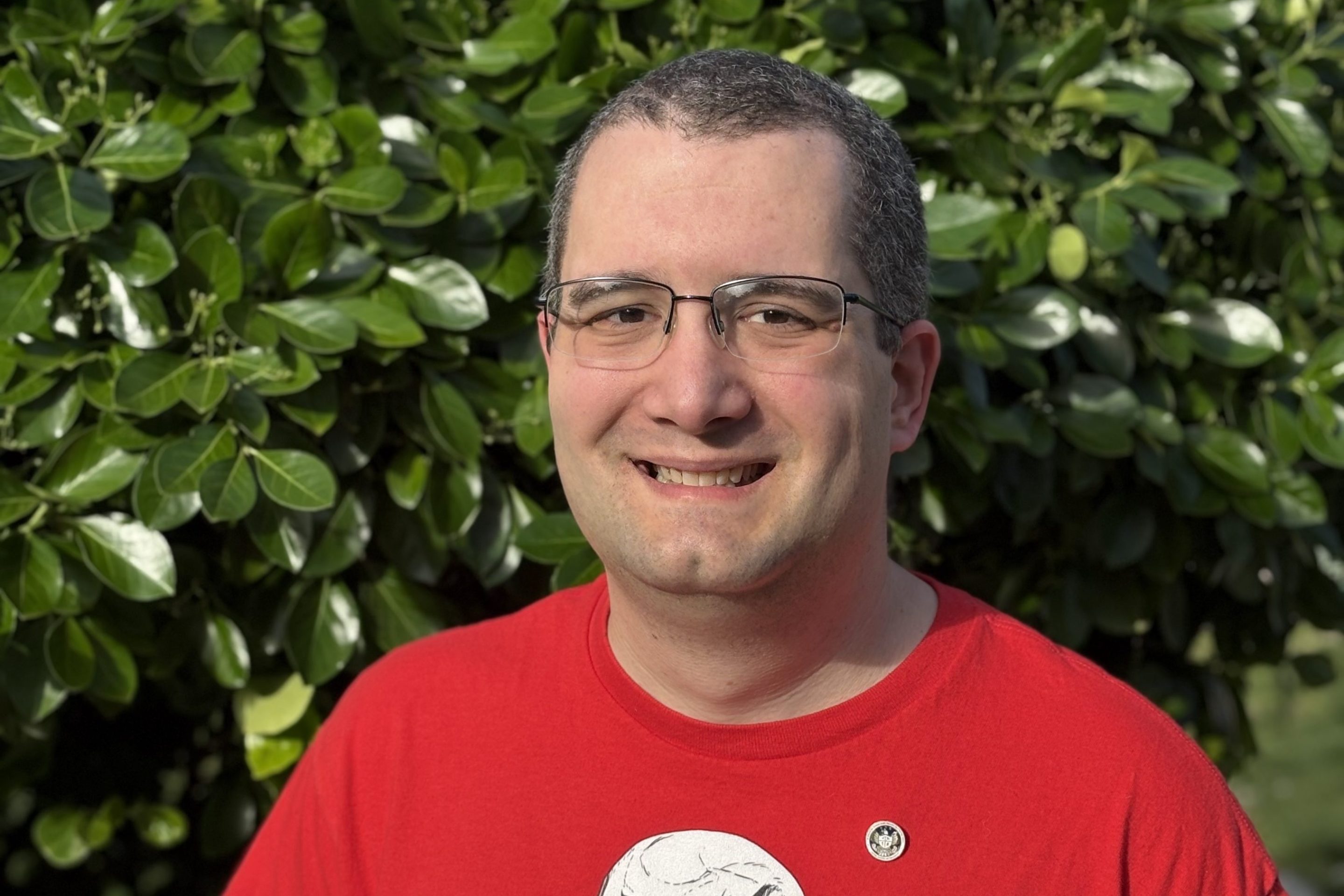 a photo of Chuck Sebian-Lander, a fired CFPB web manager. He is wearing a a shirt from my union, NTEU 335, and b) a lapel pin with the CFPB seal that he was given as part of a Director's award