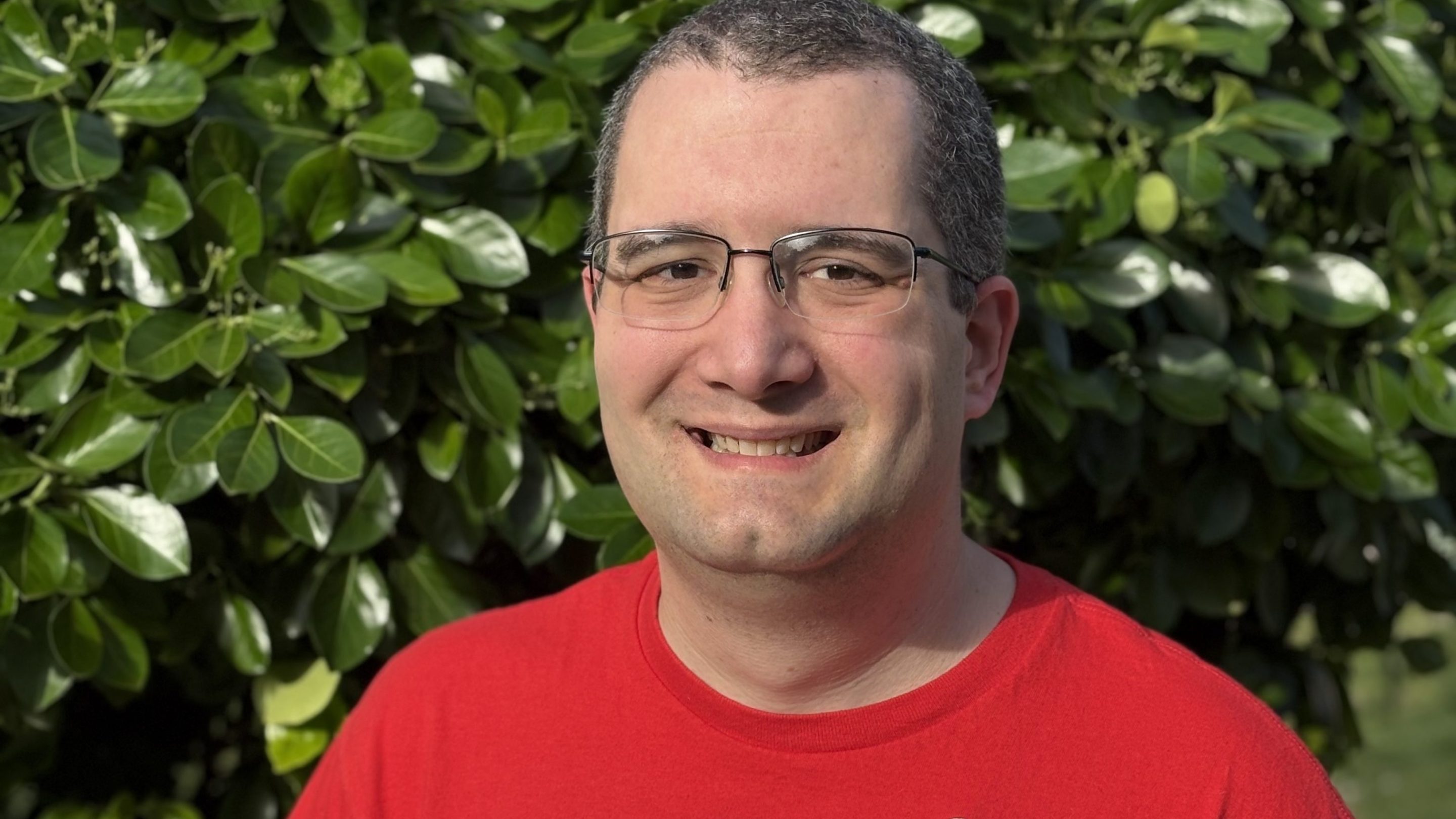 a photo of Chuck Sebian-Lander, a fired CFPB web manager. He is wearing a a shirt from my union, NTEU 335, and b) a lapel pin with the CFPB seal that he was given as part of a Director's award