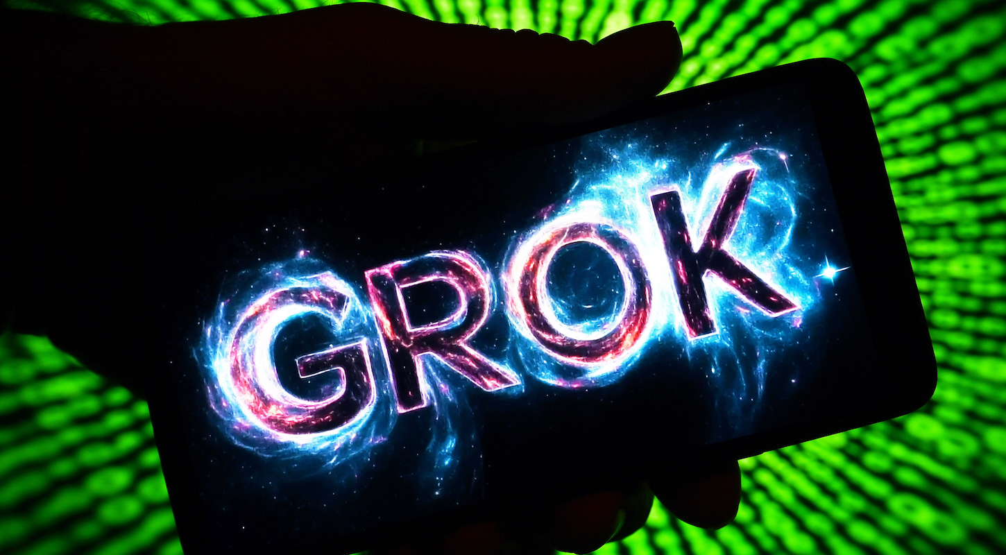 The obnoxious Grok logo, on a phone screen, in a hand silhouetted against a neon green background.
