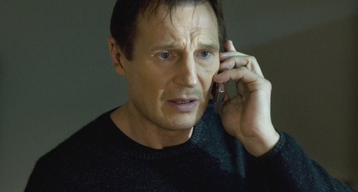 A screenshot of Liam Neeson in the movie Taken, speaking into a cellphone.