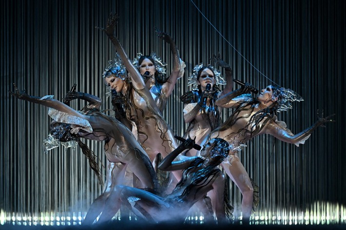 Latvia performs at the 2025 Eurovision. Six women in the group, all wearing weird folklore-esque outfits.