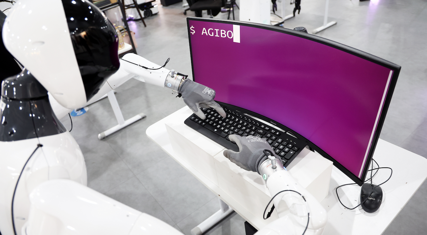 Humanoid robot practices typing at the Data Collection Center of AgiBot on March 20, 2025 in Shanghai, China.