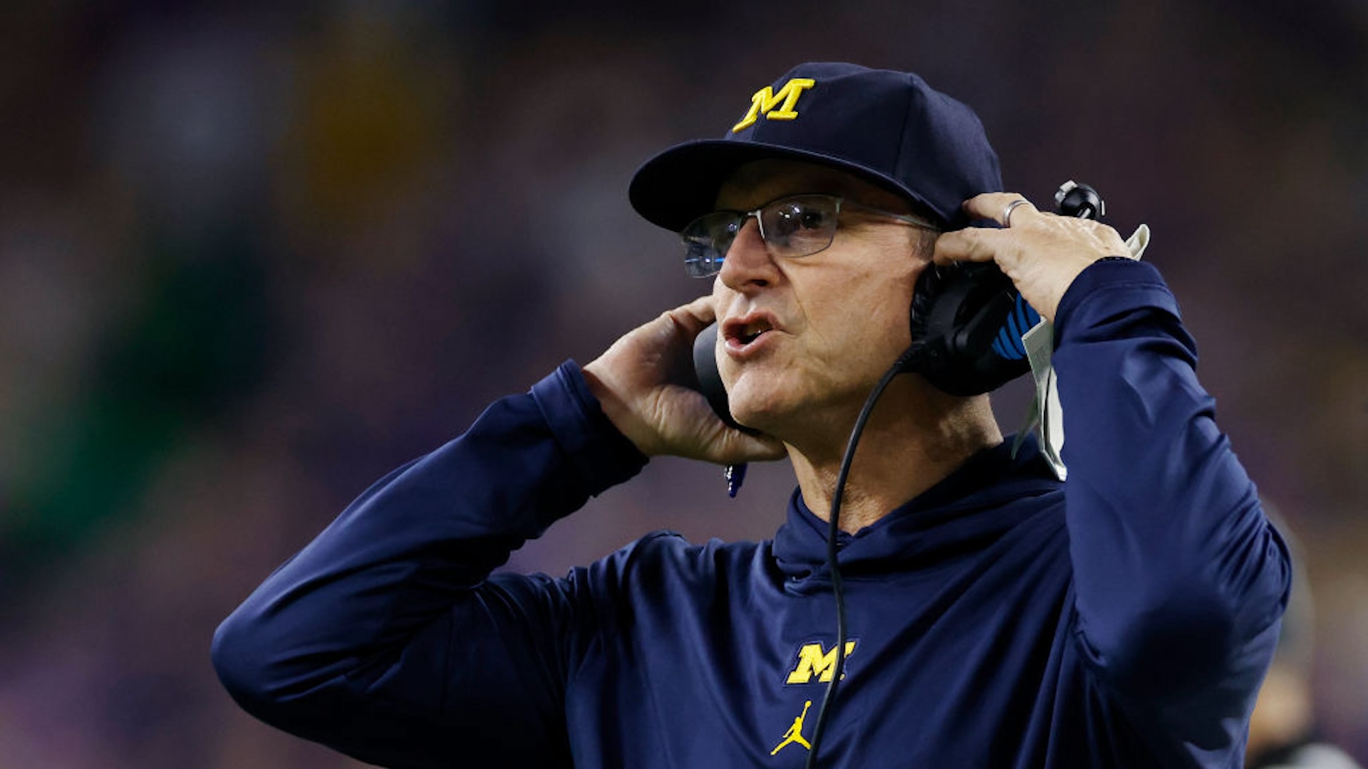 Michigan Wolverines head coach Jim Harbaugh looks on during the CFP National Championship against the Washington Huskies on January 08, 2024 at NRG Stadium in Houston, Texas.