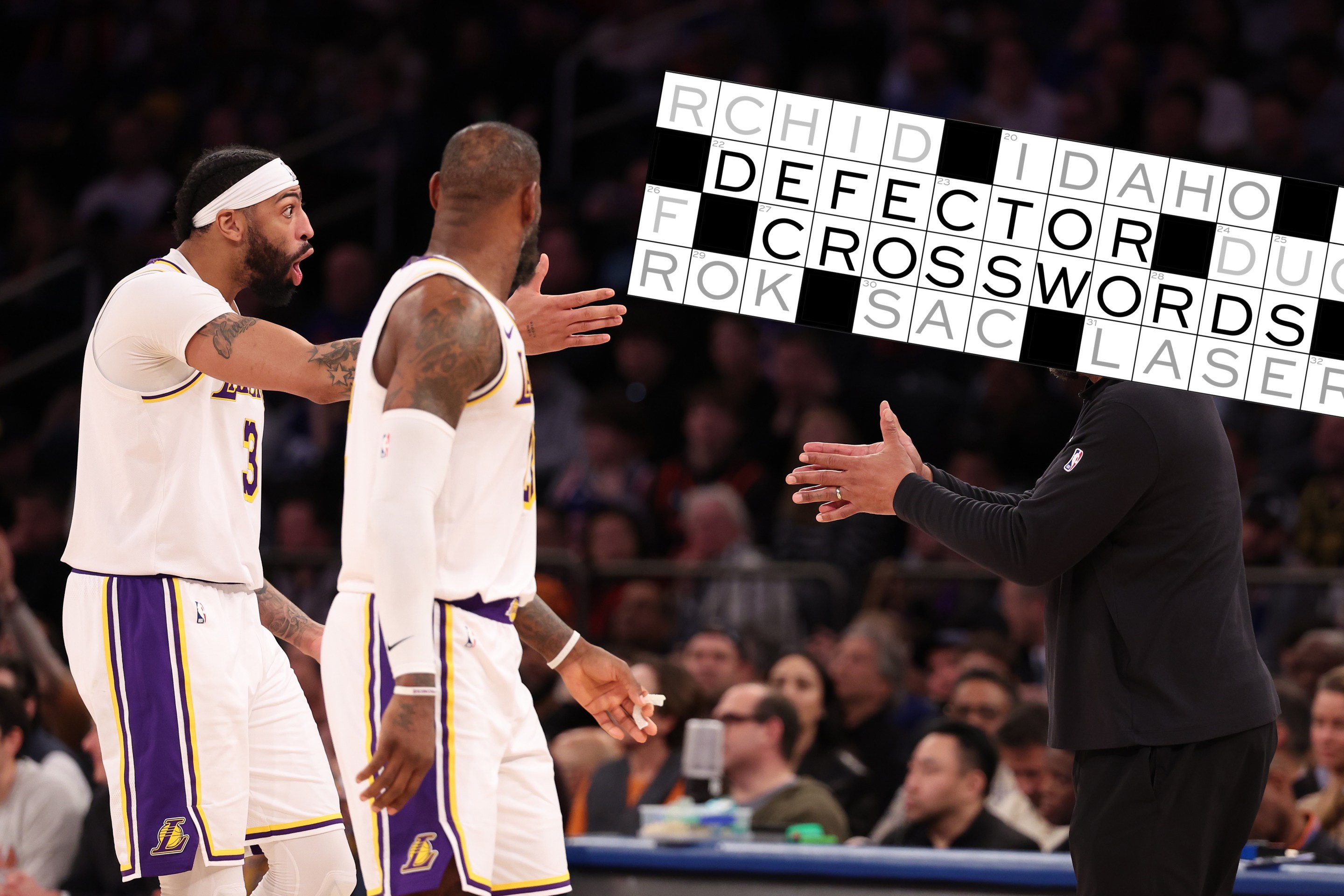 Anthony Davis #3 and LeBron James #23 of the Los Angeles Lakers talk to their head coach Darvin Ham during their game against the New York Knicks at Madison Square Garden on February 03, 2024 in New York City.