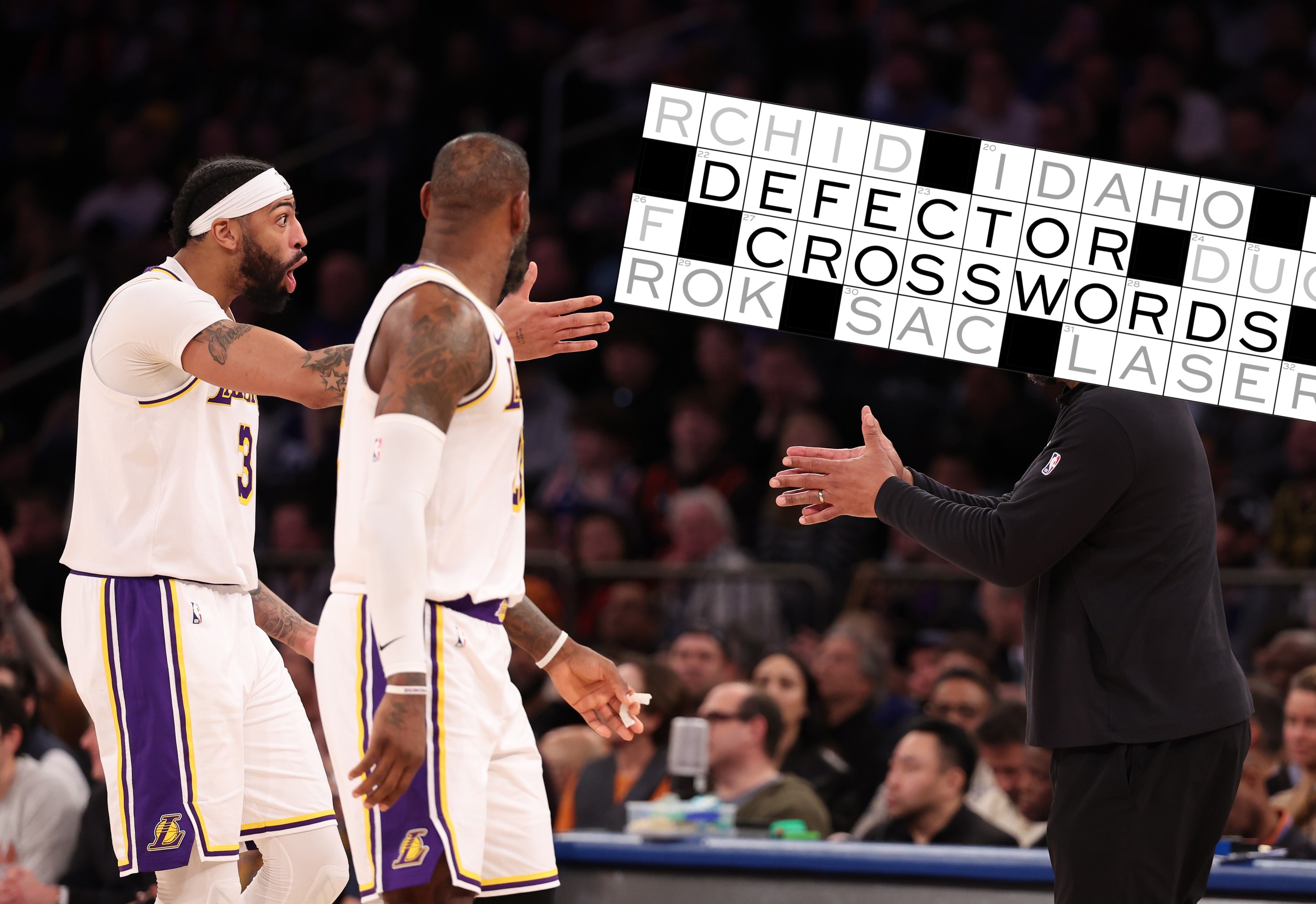 Anthony Davis #3 and LeBron James #23 of the Los Angeles Lakers talk to their head coach Darvin Ham during their game against the New York Knicks at Madison Square Garden on February 03, 2024 in New York City.