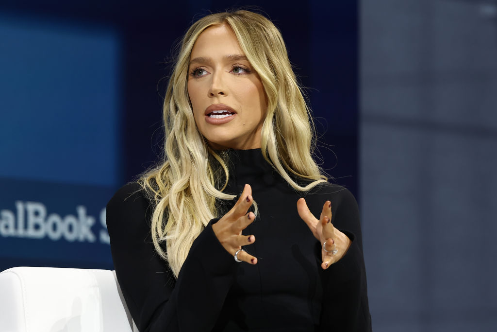 Alex Cooper, host of “Call Her Daddy” and founder of the Unwell Network, speaks during the New York Times annual DealBook