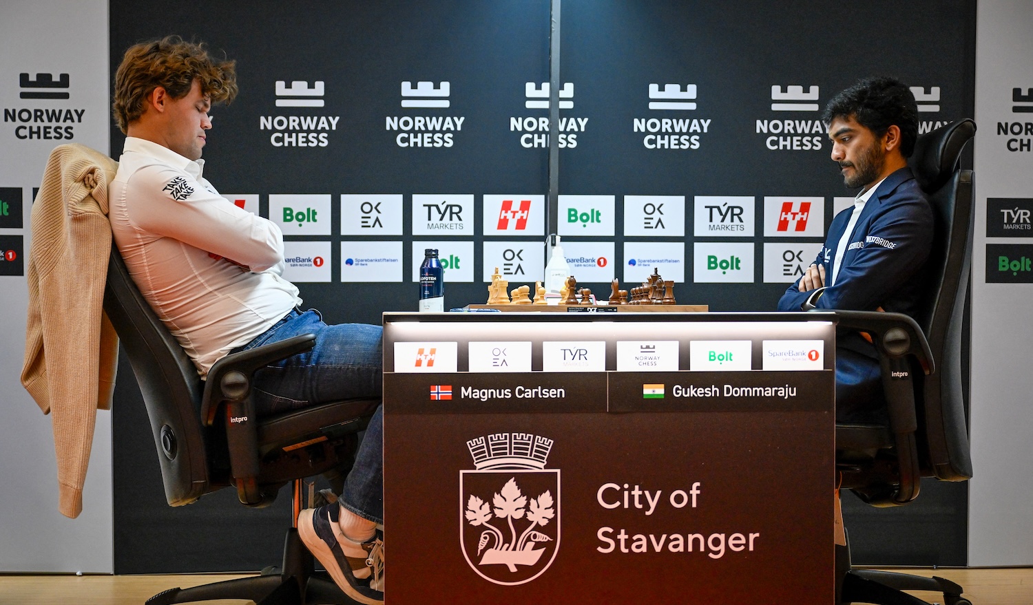 Norway's Magnus Carlsen (L) plays against India's Gukesh Dommaraju during the first game of Norway chess tournement in Finansparken in Stavanger on May 26, 2025. (Photo by Carina Johansen / NTB / AFP) / Norway OUT