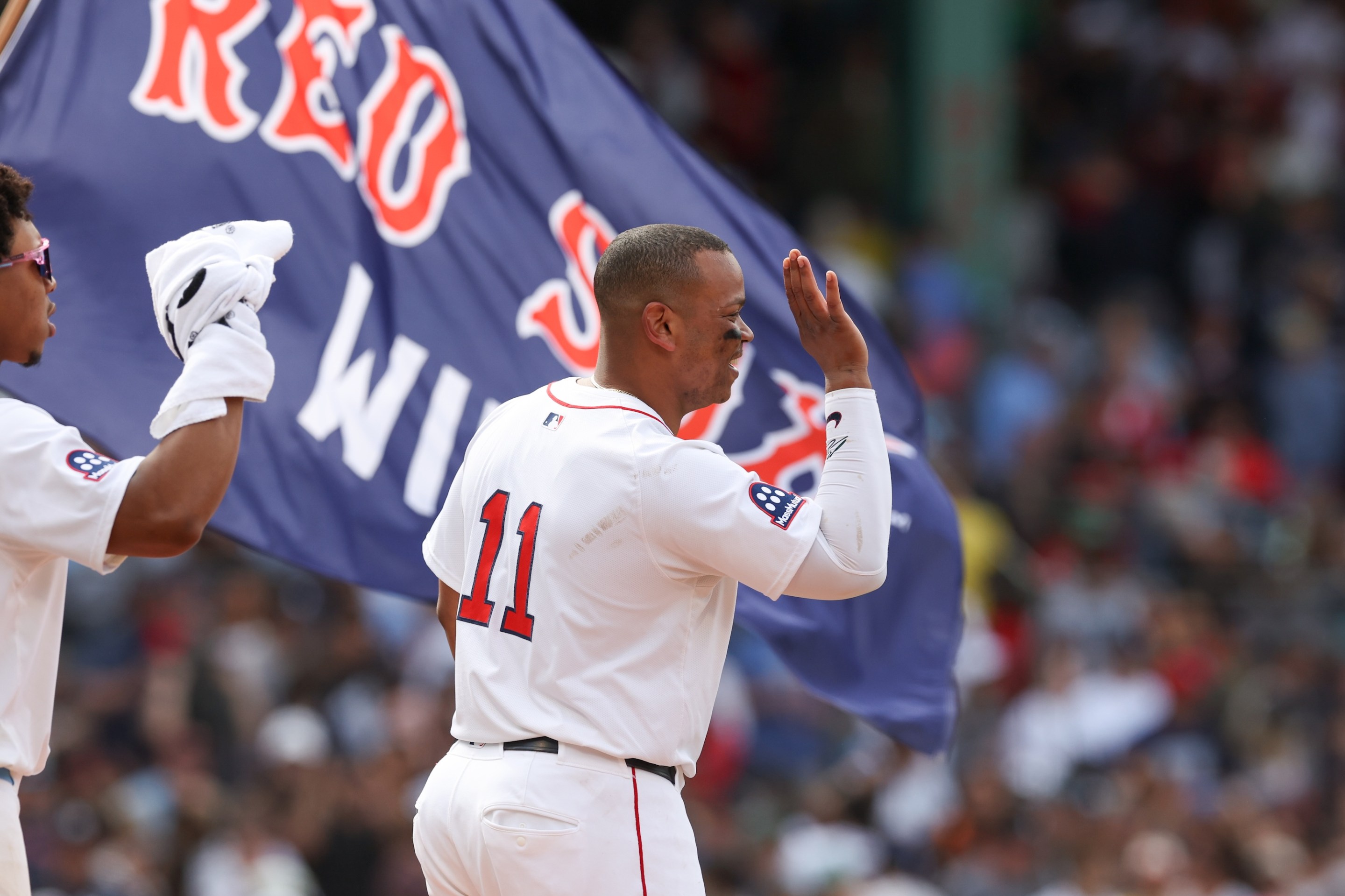 Rafael Devers #11 of the Boston Red Sox celebrates with teammates after defeating the New York Yankees in a shutout to sweep the series at Fenway Park on Sunday, June 15, 2025 in Boston, Massachusetts.