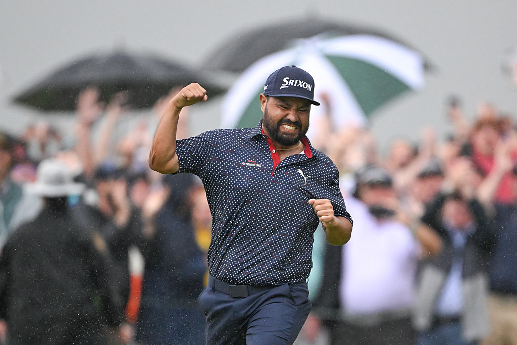 J.J. Spaun fist pumps after making the winning putt