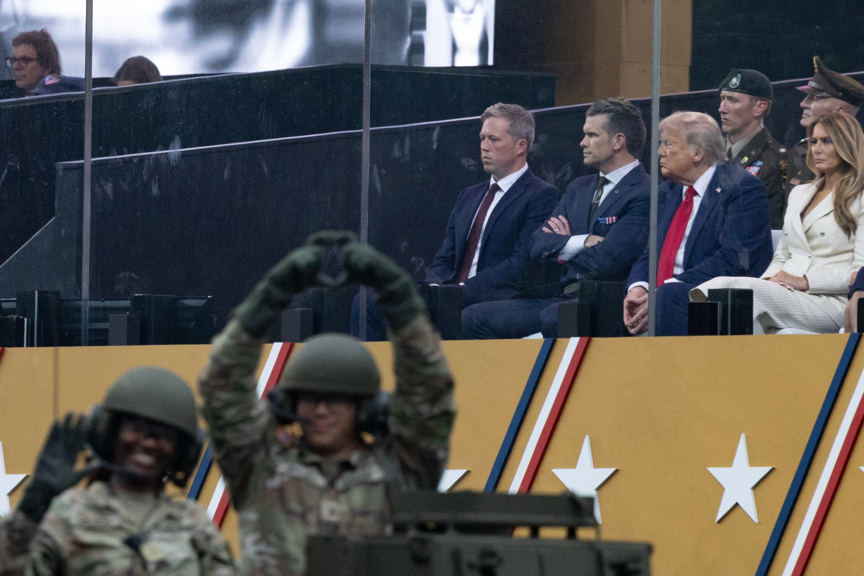 President Trump, sitting alongside Defense Secretary Pete Hegseth and First Lady Melania Trump, observe U.S. Army tanks traveling down Pennsylvania Avenue, during a celebration of the U.S. Army's 250th anniversary on Flag Day, June 14, 2025.