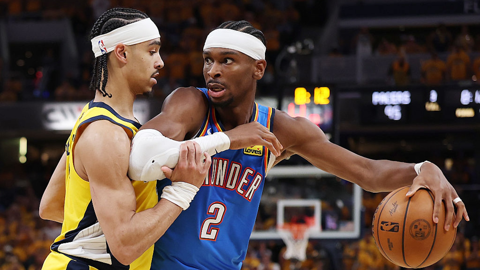 Shai Gilgeous-Alexander #2 of the Oklahoma City Thunder dribbles the ball against Andrew Nembhard #2 of the Indiana Pacers during the fourth quarter in Game Three of the 2025 NBA Finals at Gainbridge Fieldhouse on June 11, 2025 in Indianapolis, Indiana. NOTE TO USER: User expressly acknowledges and agrees that, by downloading and or using this photograph, User is consenting to the terms and conditions of the Getty Images License Agreement.