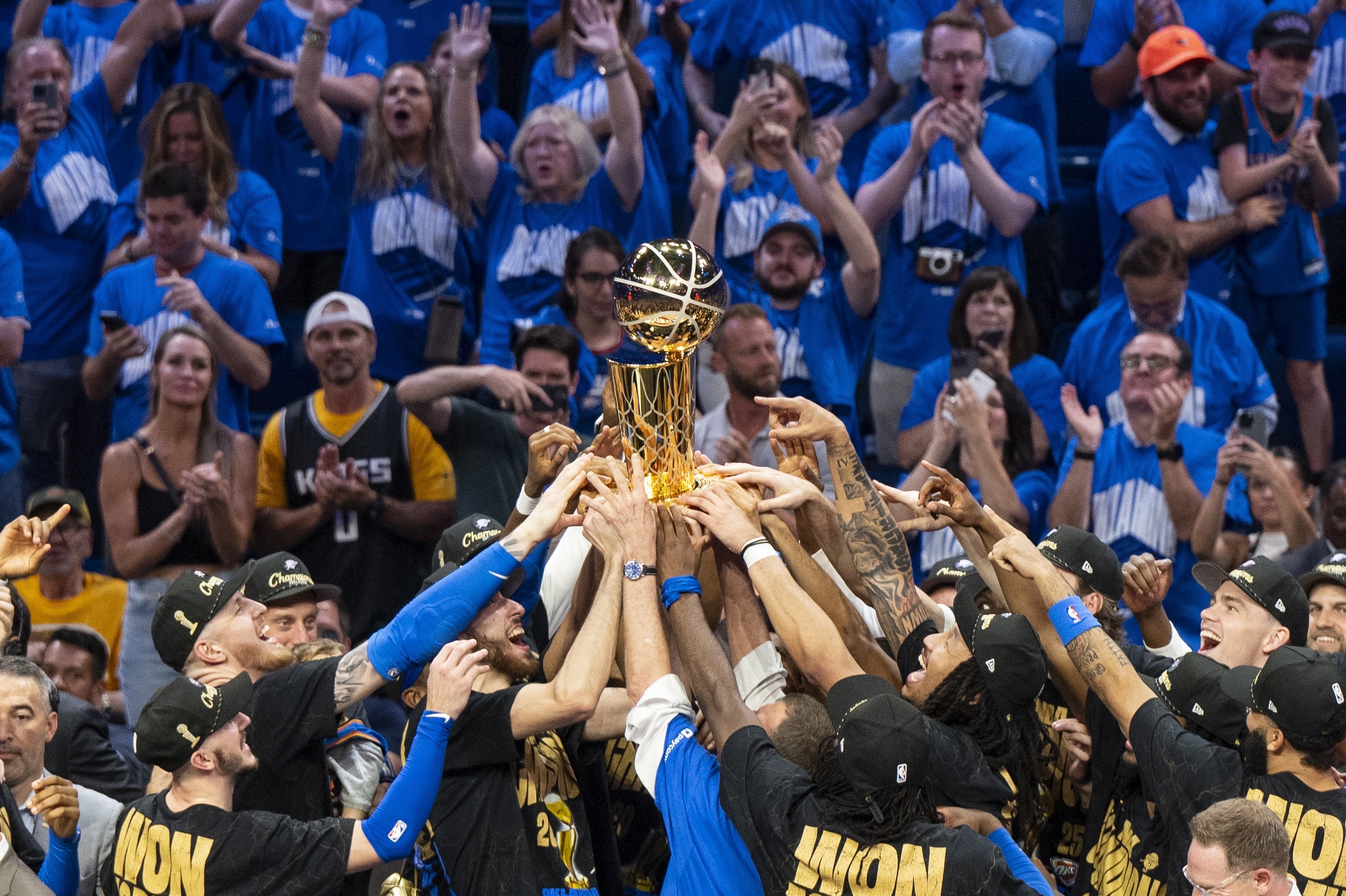Oklahoma City, Oklahoma - JUNE 22: Oklahoma City Thunder players celebrate with the Larry O'Brien trophy after winning Game Seven of the 2025 NBA Finals against the Indiana Pacers at Paycom Center on June 22, 2025 in Oklahoma City, Oklahoma, United States. (Photo by Mostafa Bassim/Anadolu via Getty Images)