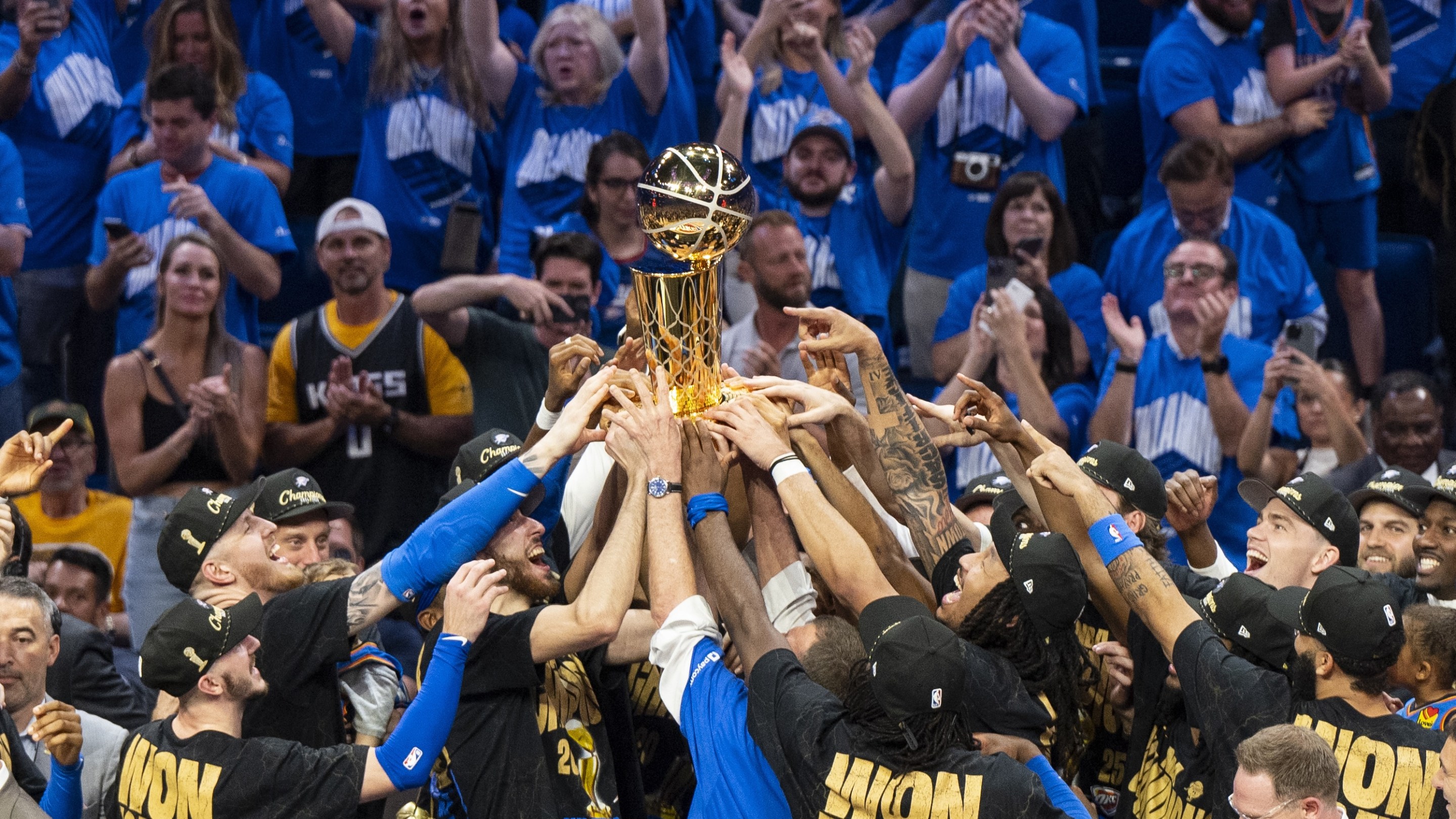 Oklahoma City, Oklahoma - JUNE 22: Oklahoma City Thunder players celebrate with the Larry O'Brien trophy after winning Game Seven of the 2025 NBA Finals against the Indiana Pacers at Paycom Center on June 22, 2025 in Oklahoma City, Oklahoma, United States. (Photo by Mostafa Bassim/Anadolu via Getty Images)