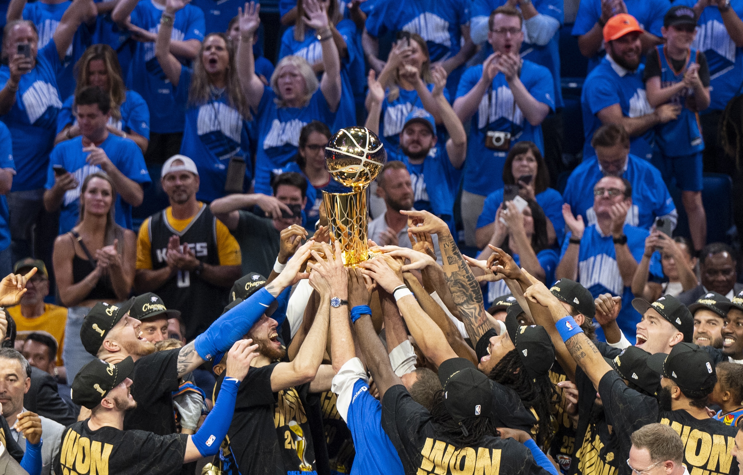 Oklahoma City, Oklahoma - JUNE 22: Oklahoma City Thunder players celebrate with the Larry O'Brien trophy after winning Game Seven of the 2025 NBA Finals against the Indiana Pacers at Paycom Center on June 22, 2025 in Oklahoma City, Oklahoma, United States. (Photo by Mostafa Bassim/Anadolu via Getty Images)