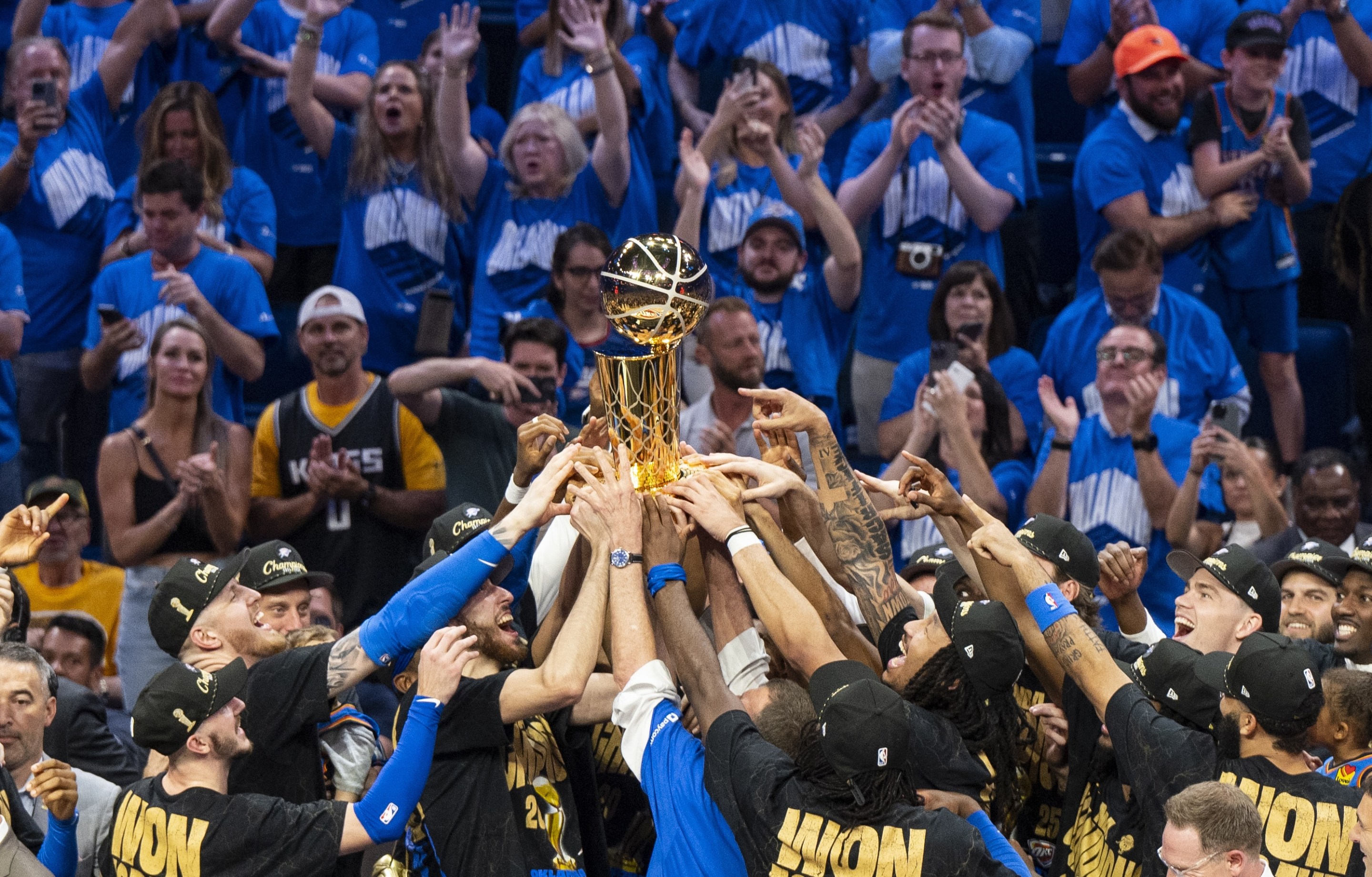 Oklahoma City, Oklahoma - JUNE 22: Oklahoma City Thunder players celebrate with the Larry O'Brien trophy after winning Game Seven of the 2025 NBA Finals against the Indiana Pacers at Paycom Center on June 22, 2025 in Oklahoma City, Oklahoma, United States. (Photo by Mostafa Bassim/Anadolu via Getty Images)
