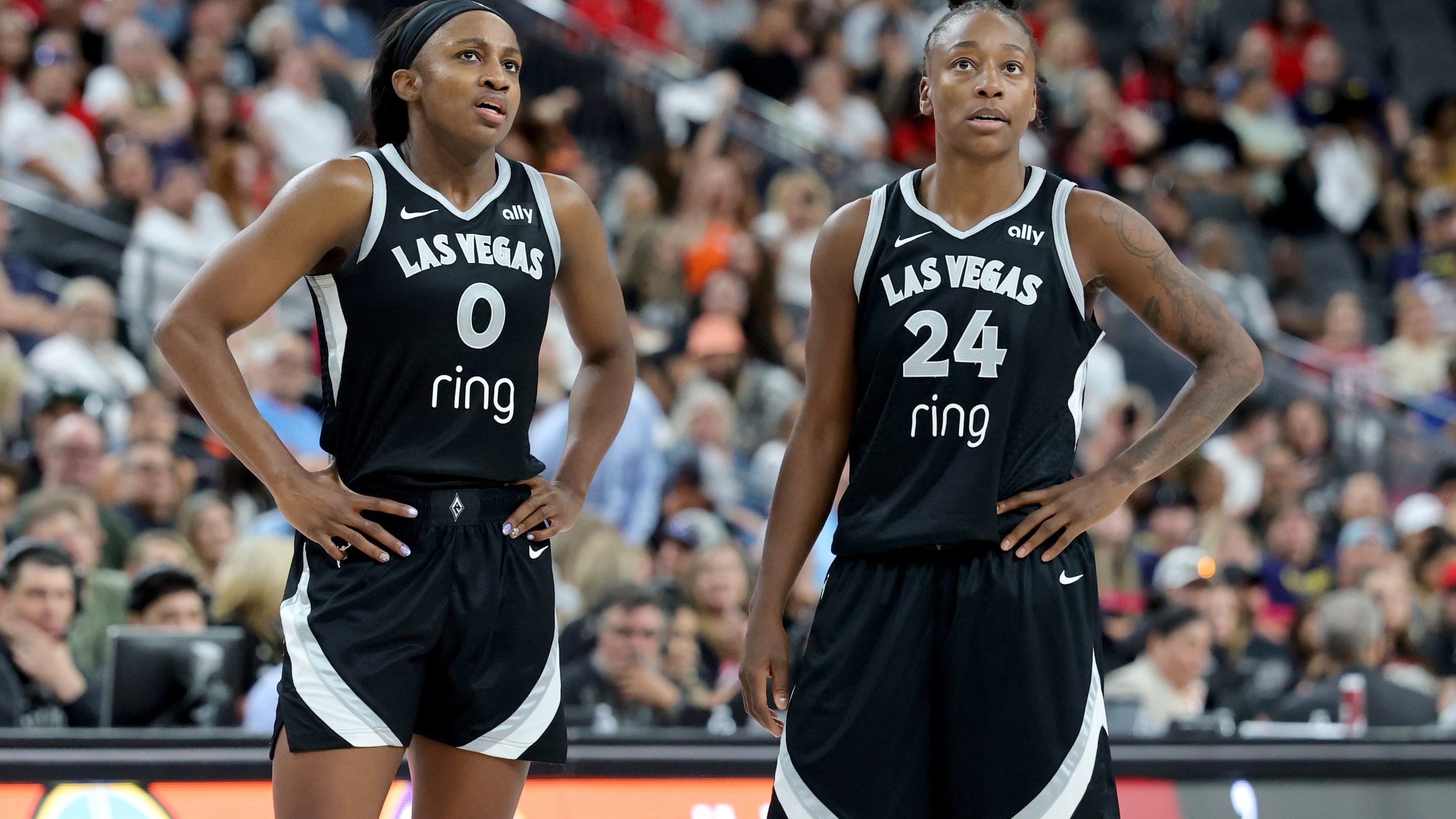 Jackie Young #0 and Jewell Loyd #24 of the Las Vegas Aces talk as they wait for an Indiana Fever player to shoot a free throw in the fourth quarter of their game at T-Mobile Arena on June 22, 2025 in Las Vegas, Nevada. The Aces defeated the Fever 89-81.