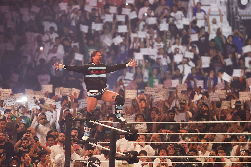 US wrestler CM Punk greets the fans before his match against against John Cena for the undisputed WWE Championship during the King of the Ring event at Kingdom Arena in Riyadh on June 28, 2025.