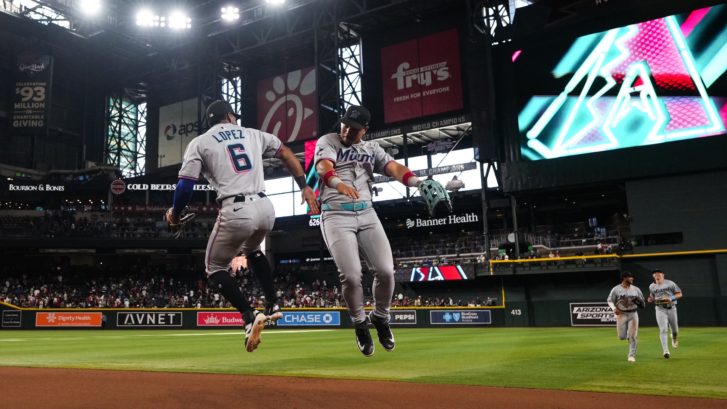 PHOENIX, ARIZONA - JUNE 28: Otto Lopez #6 of the Miami Marlins and Heriberto Hernandez #64 of the Miami Marlins celebrate after defeating the Arizona Diamondbacks at Chase Field on June 28, 2025 in Phoenix, Arizona. (Photo by Jasen Vinlove/Miami Marlins/Getty Images)