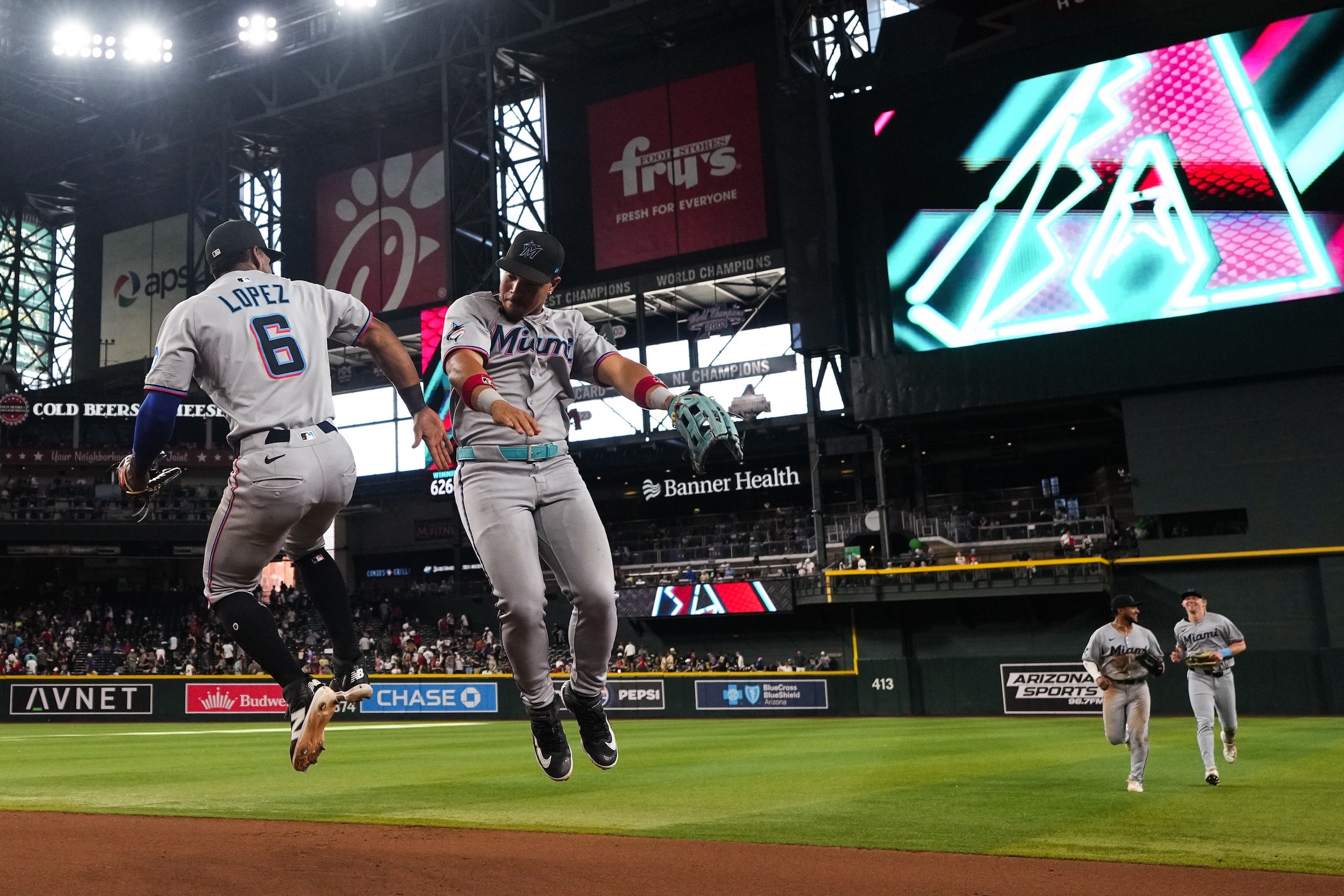 PHOENIX, ARIZONA - JUNE 28: Otto Lopez #6 of the Miami Marlins and Heriberto Hernandez #64 of the Miami Marlins celebrate after defeating the Arizona Diamondbacks at Chase Field on June 28, 2025 in Phoenix, Arizona. (Photo by Jasen Vinlove/Miami Marlins/Getty Images)