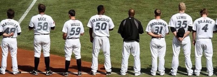 Brian Jeroloman on the field with the Toronto Blue Jays during the national anthem.
