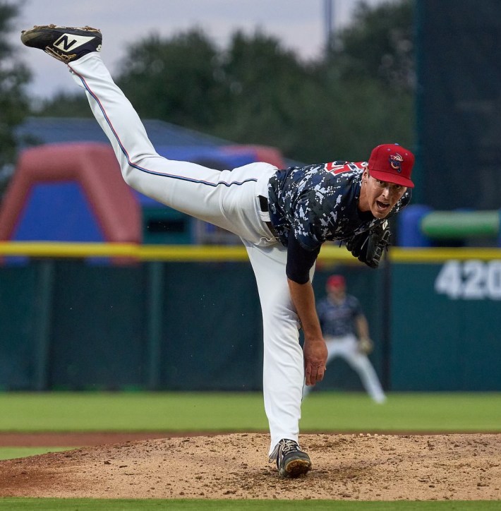 Parker Bugg pitching in a minor league game.