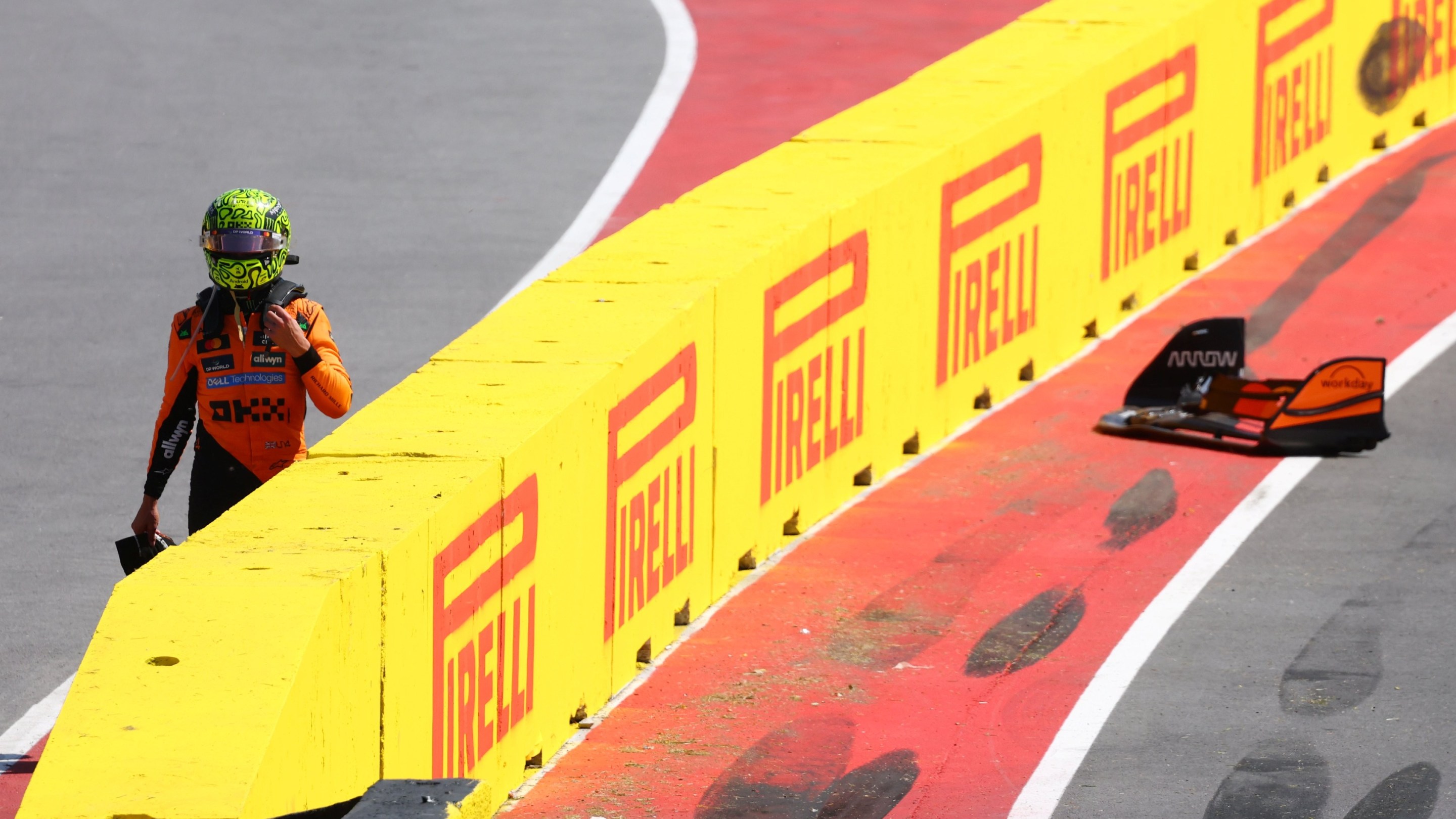 Lando Norris walks away after a crash during the F1 Grand Prix of Canada.