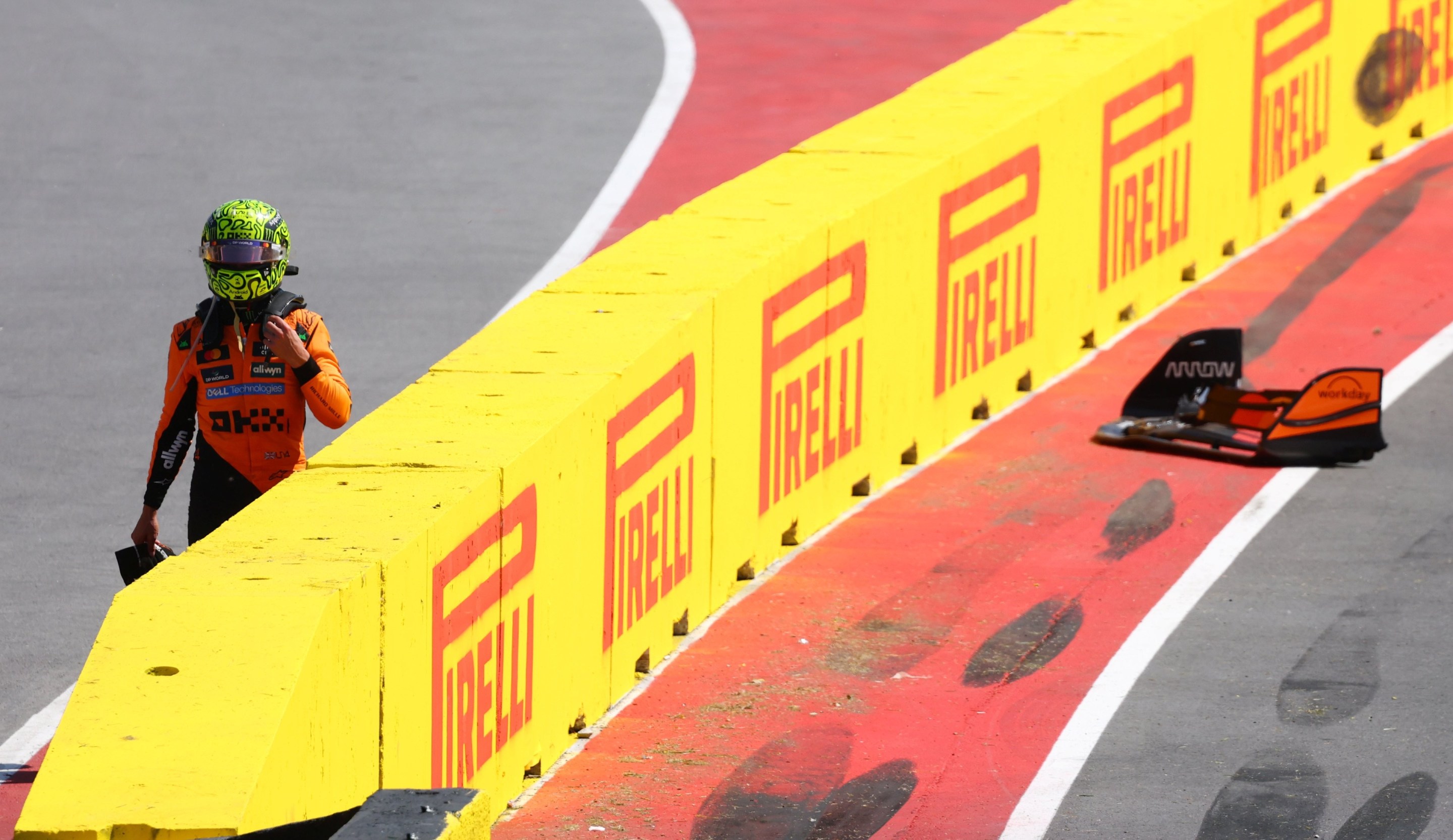 Lando Norris walks away after a crash during the F1 Grand Prix of Canada.