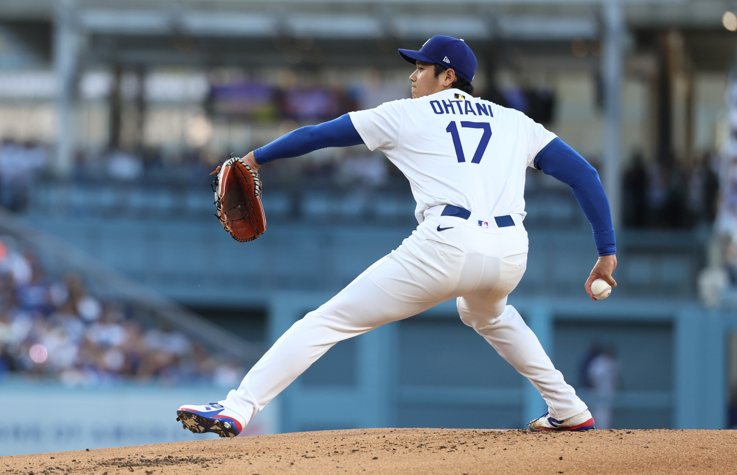 Los Angeles Dodgers starting pitcher Shohei Ohtani throws to a San Diego Padres batter during the first inning.