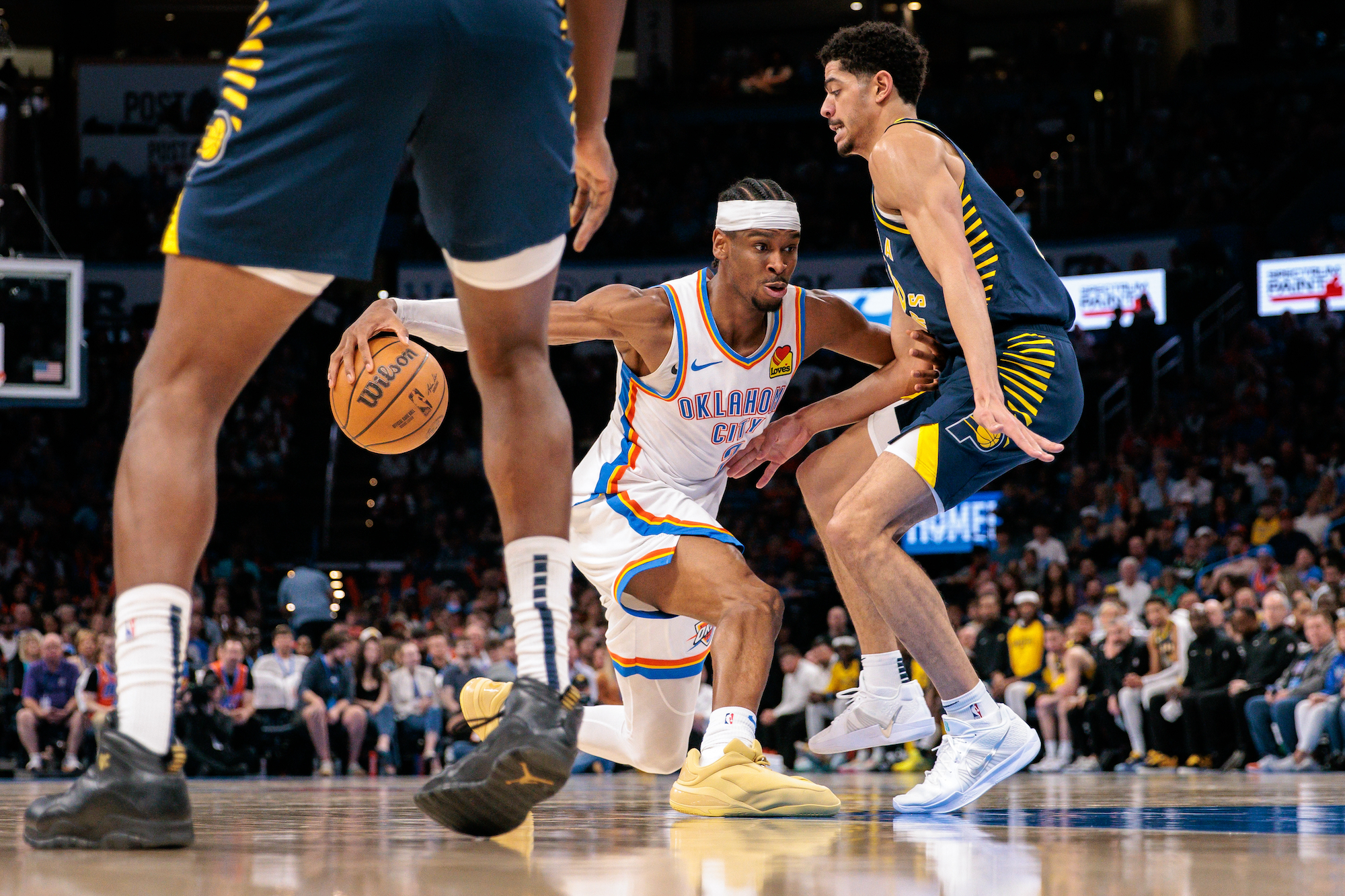Shai Gilgeous-Alexander of the Oklahoma City Thunder drives around Tyrese Haliburton of the Indiana Pacers during the fourth quarter on March 29, 2025 in Oklahoma City, Oklahoma.