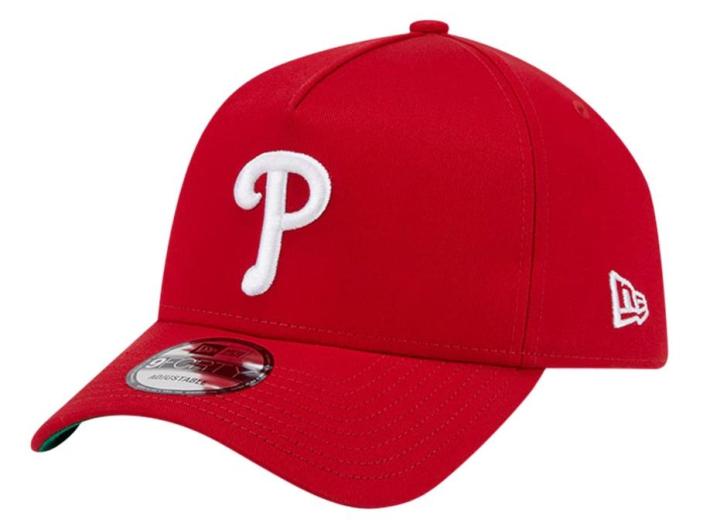 A red hat with a white letter on it