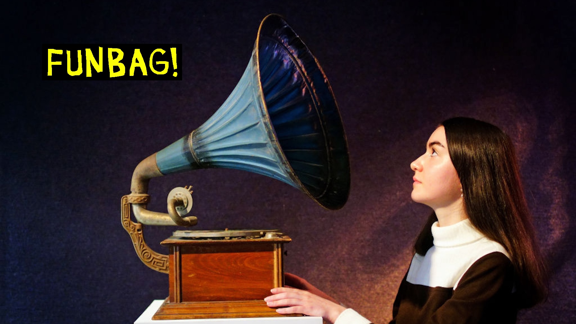 A gallery assistant looks at a vintage horn gramophone belonging to John Peel during a photo call for highlights from Bonhams Live In Session: Property From The John Peel Archive sale which takes place on Tuesday June 14 at Bonhams in London. Picture date: Friday June 10, 2022.