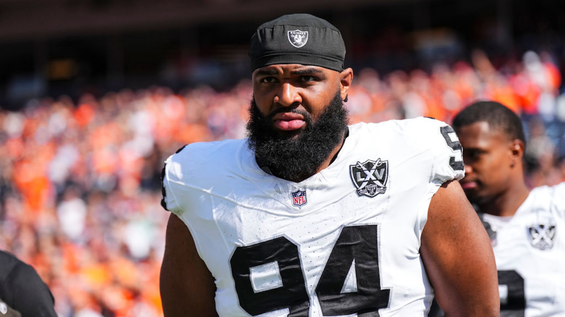 Christian Wilkins #94 of the Las Vegas Raiders looks on from the sideline prior to an NFL football game against the Denver Broncos at Empower Field at Mile High on October 6, 2024 in Denver, Colorado.