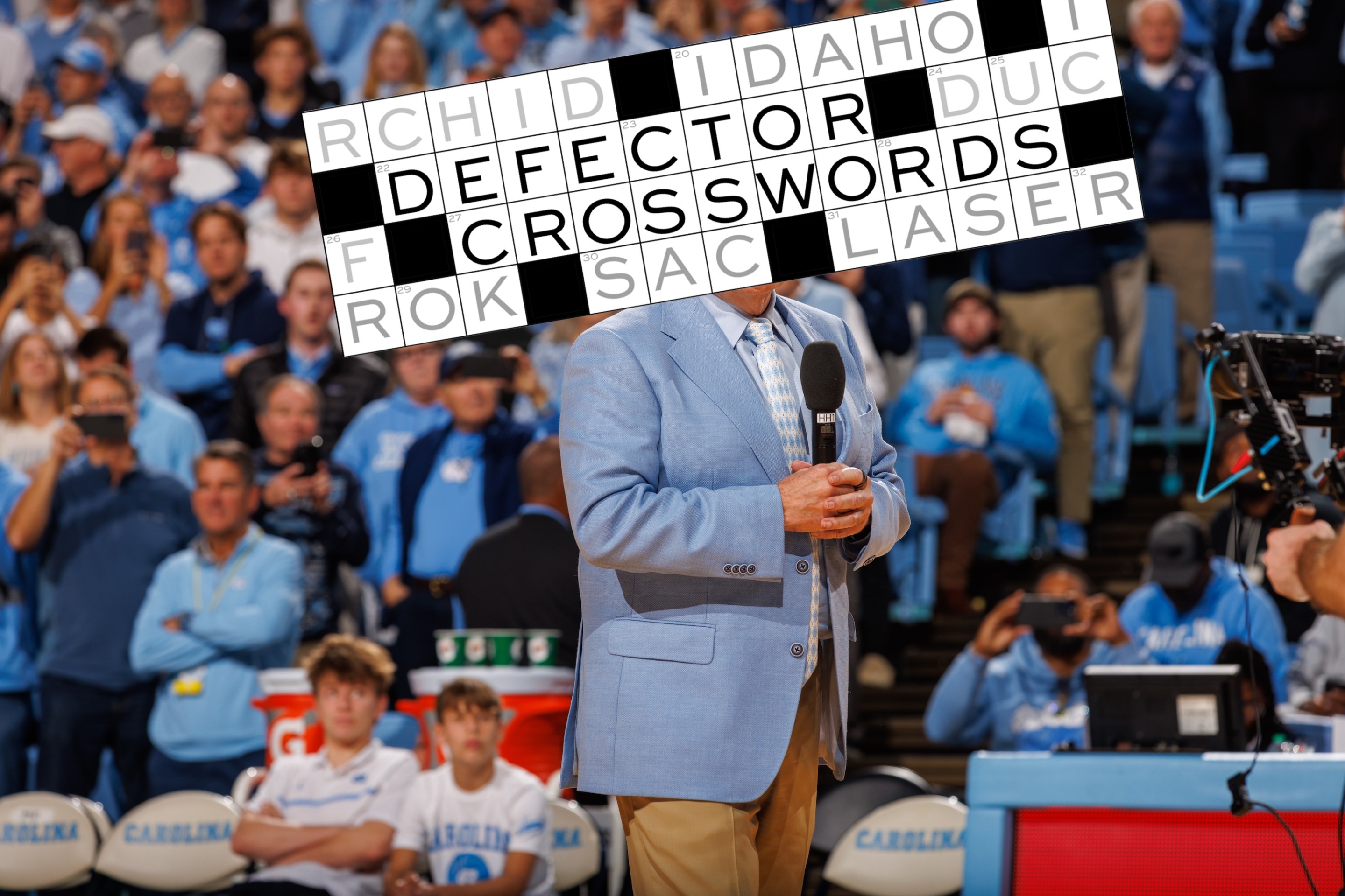 North Carolina Tar Heels football head coach Bill Belichick speaks to the crowd during a basketball game against the La Salle Explorers on December 14, 2024 at the Dean Smith Center in Chapel Hill, North Carolina. North Carolina won 93-67.