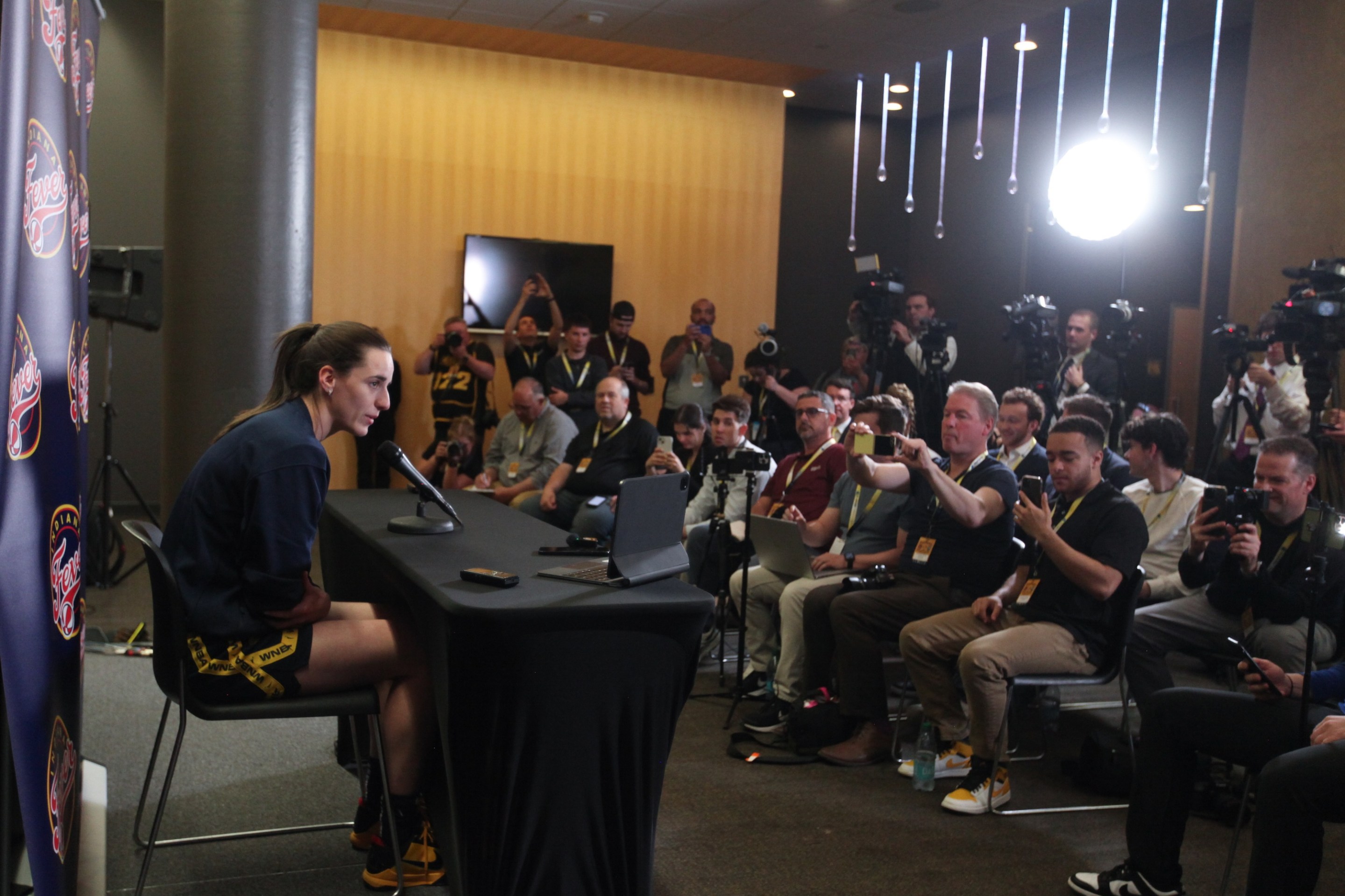 Guard Caitlin Clark #22 of the Indiana Fever talks to the media during a press conference before the match-up against the Brazil National Team, at Carver-Hawkeye Arena on March 4, 2025 in Iowa City, Iowa.