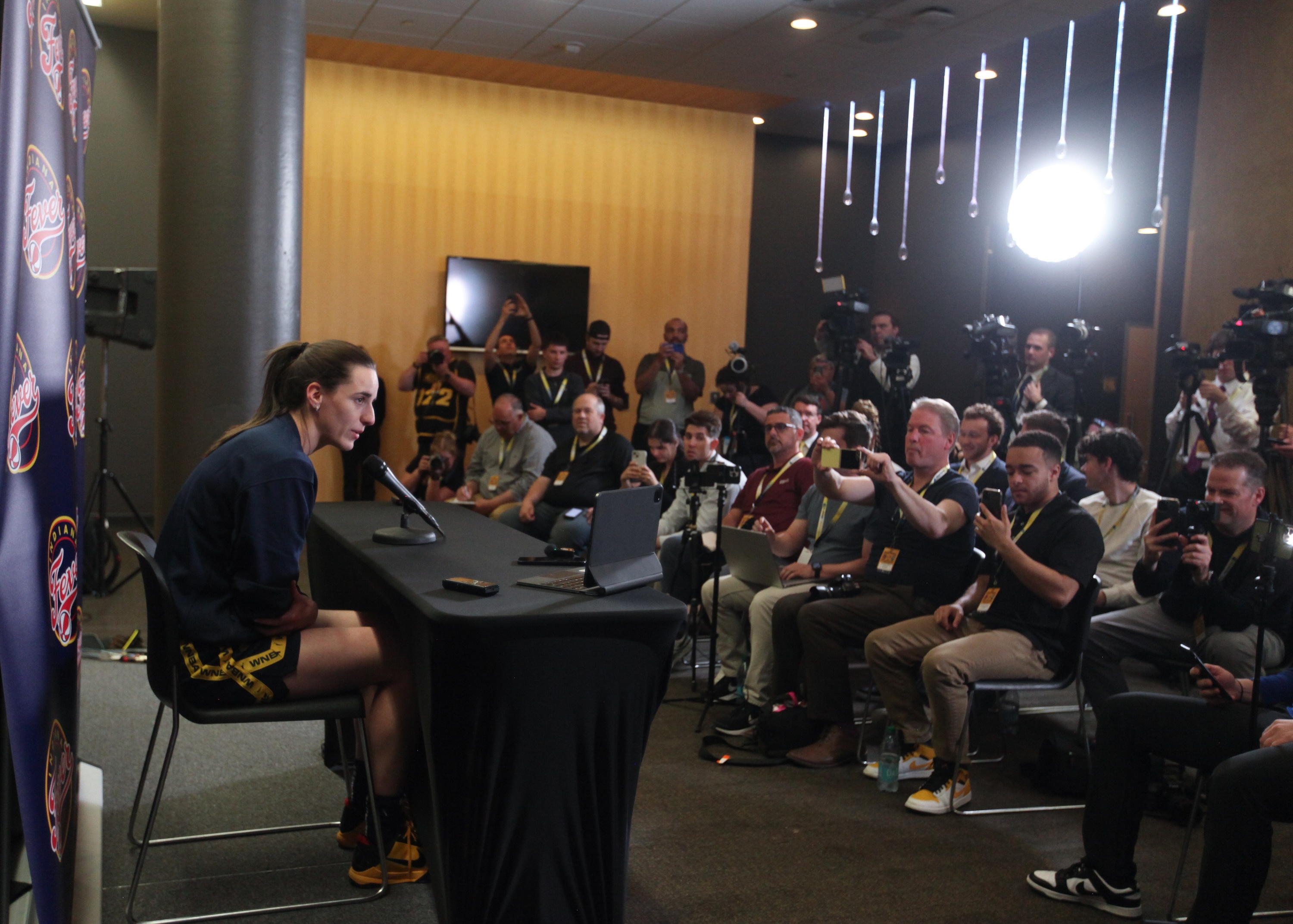Guard Caitlin Clark #22 of the Indiana Fever talks to the media during a press conference before the match-up against the Brazil National Team, at Carver-Hawkeye Arena on March 4, 2025 in Iowa City, Iowa.