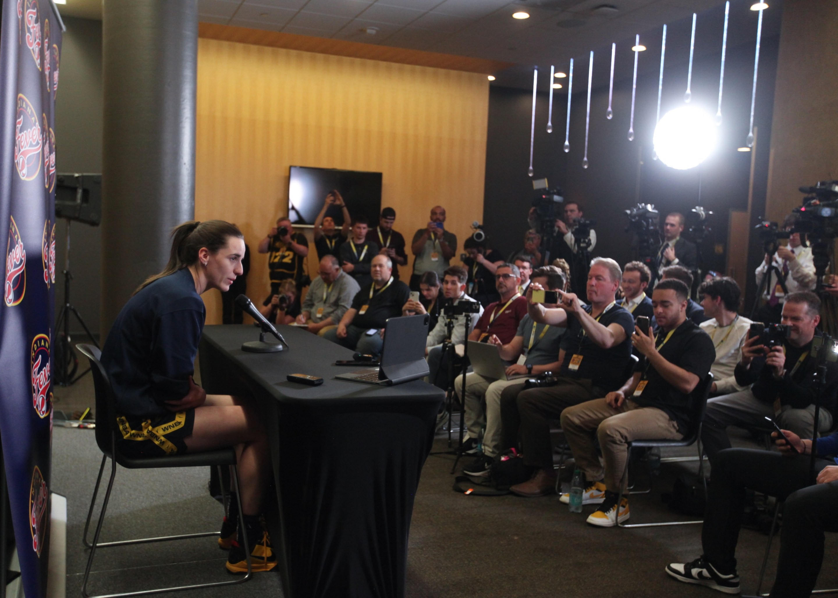 Guard Caitlin Clark #22 of the Indiana Fever talks to the media during a press conference before the match-up against the Brazil National Team, at Carver-Hawkeye Arena on March 4, 2025 in Iowa City, Iowa.