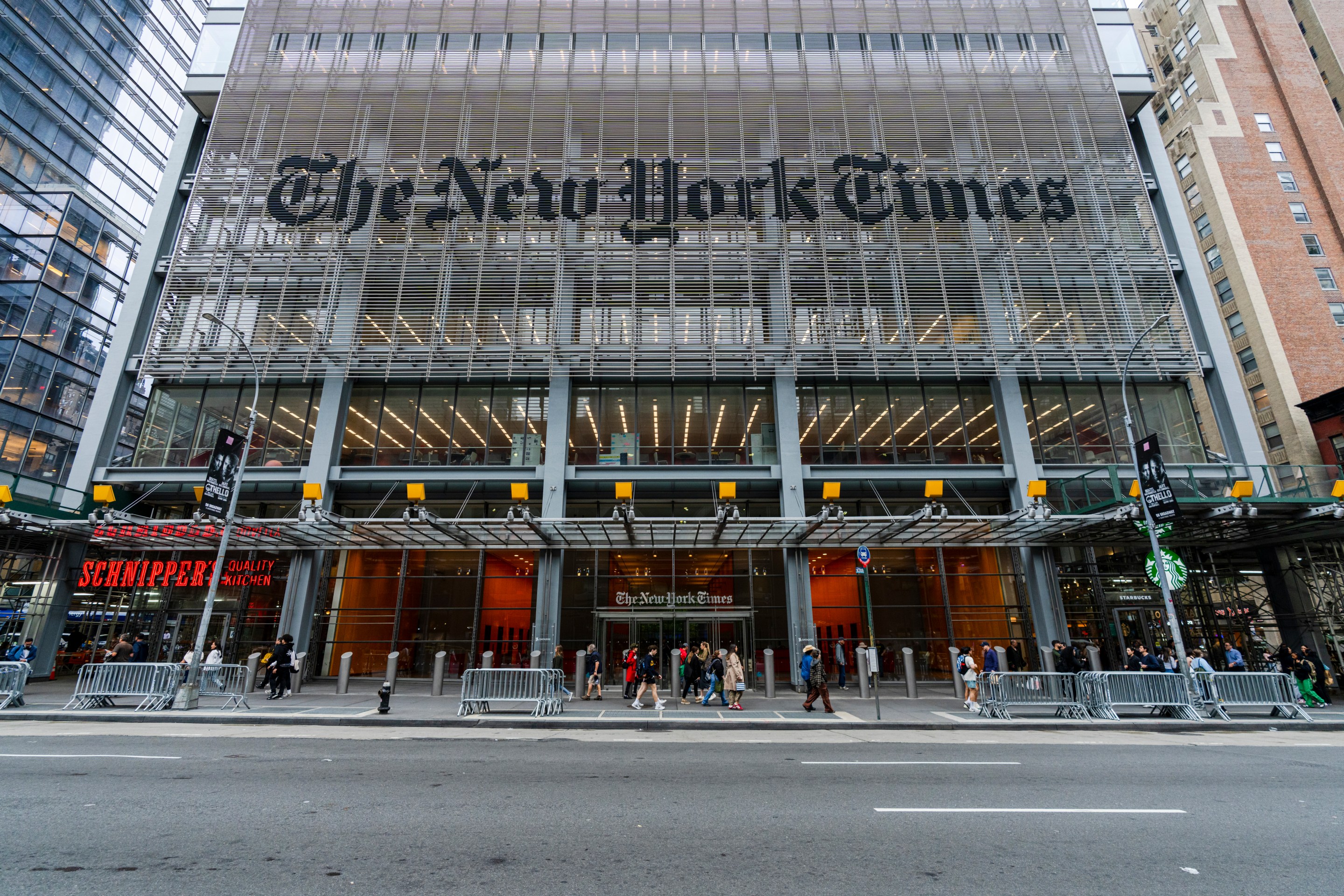 The front of the New York Times building on 8th Avenue during sunset