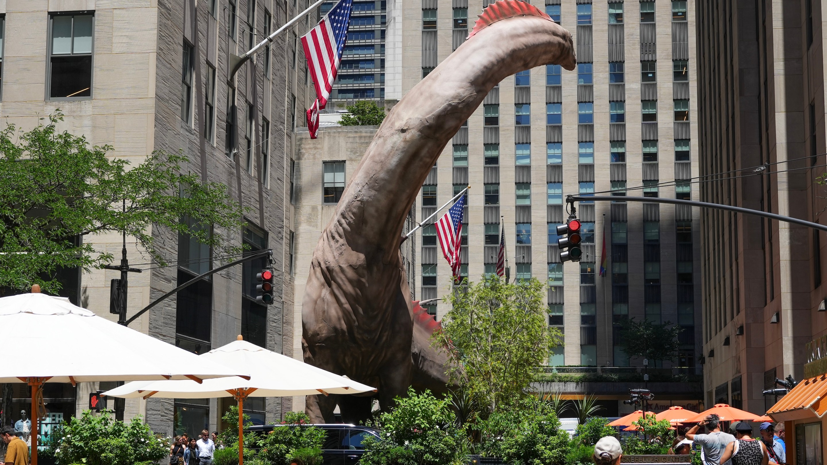 NEW YORK, NY - JUNE 24: A 5-story Titanosaurus towers over Rockefeller Center to promote the film "Jurassic World: Rebirth" on June 24, 2025 in New York City. (Photo by Liao Pan/China News Service/VCG via Getty Images)