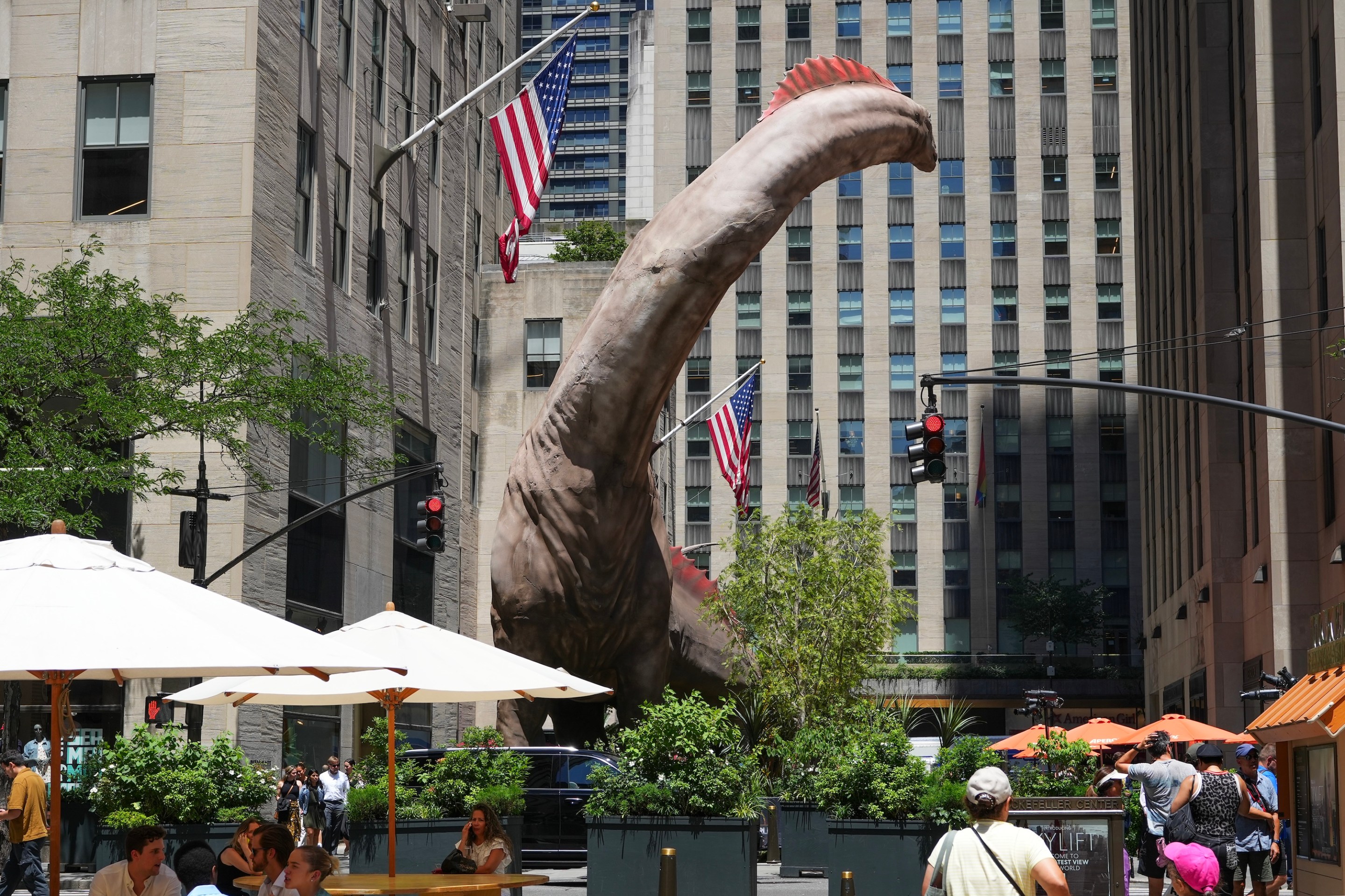 NEW YORK, NY - JUNE 24: A 5-story Titanosaurus towers over Rockefeller Center to promote the film "Jurassic World: Rebirth" on June 24, 2025 in New York City. (Photo by Liao Pan/China News Service/VCG via Getty Images)