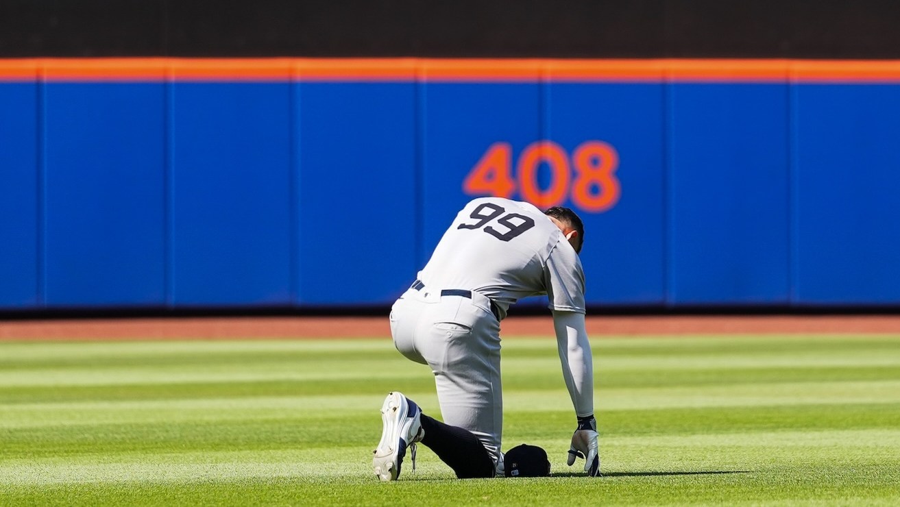 NEW YORK, NY - JULY 05: Aaron Judge #99 of the New York Yankees kneels in the outfield during the game between the New York Yankees and the New York Mets at Citi Field on Saturday, July 5, 2025 in New York, New York. (Photo by Evan Yu/MLB Photos via Getty Images)