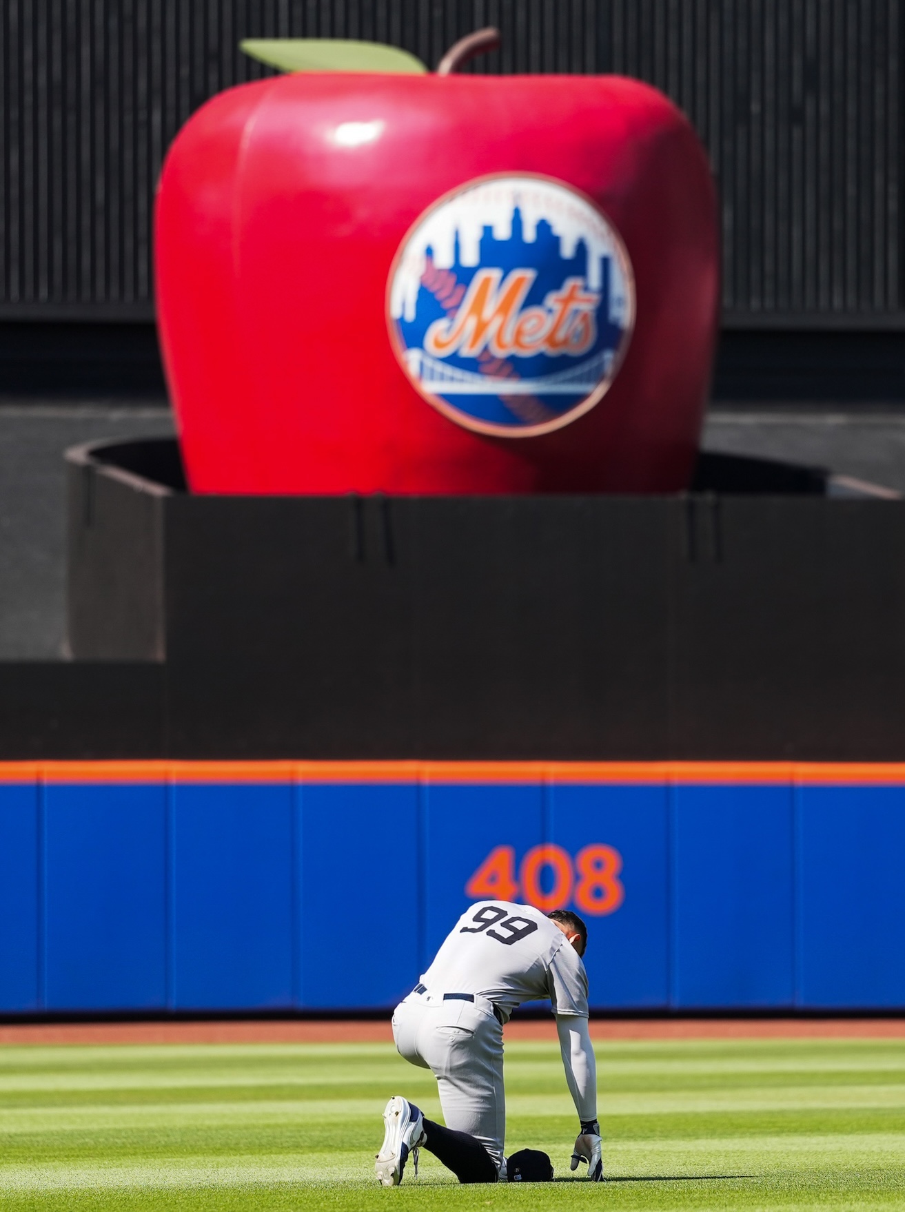NEW YORK, NY - JULY 05: Aaron Judge #99 of the New York Yankees kneels in the outfield during the game between the New York Yankees and the New York Mets at Citi Field on Saturday, July 5, 2025 in New York, New York. (Photo by Evan Yu/MLB Photos via Getty Images)