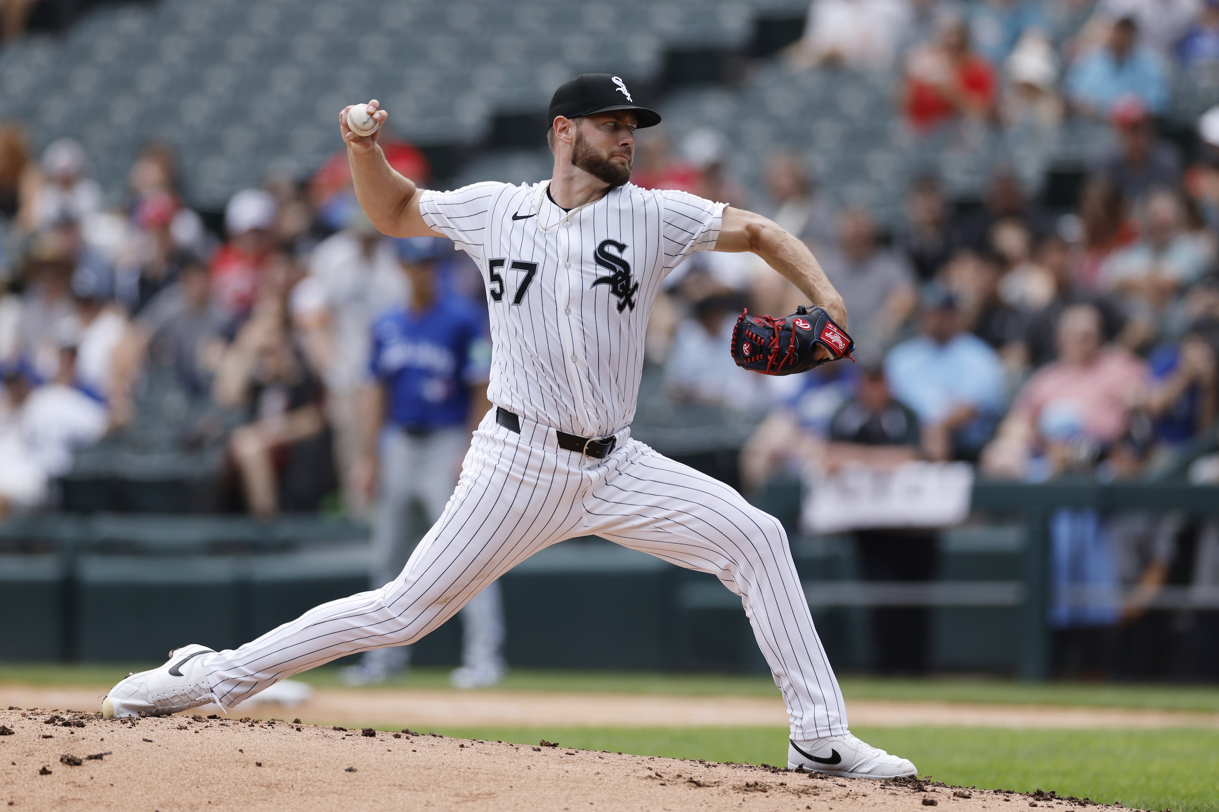Adrian Houser pitches against the Blue Jays.