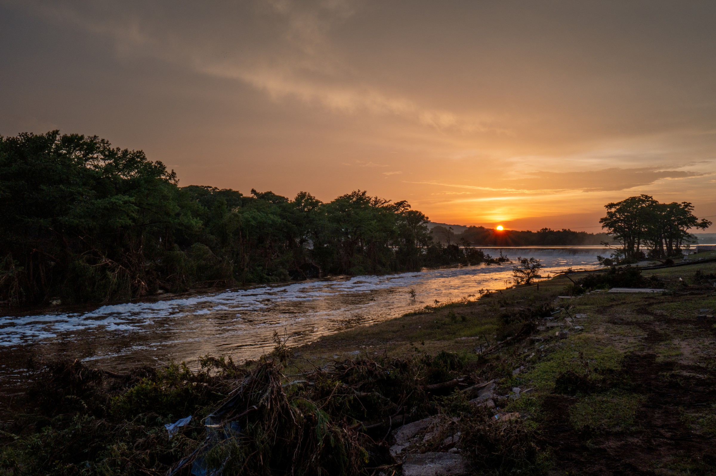 the sun sets over the guadalupe river