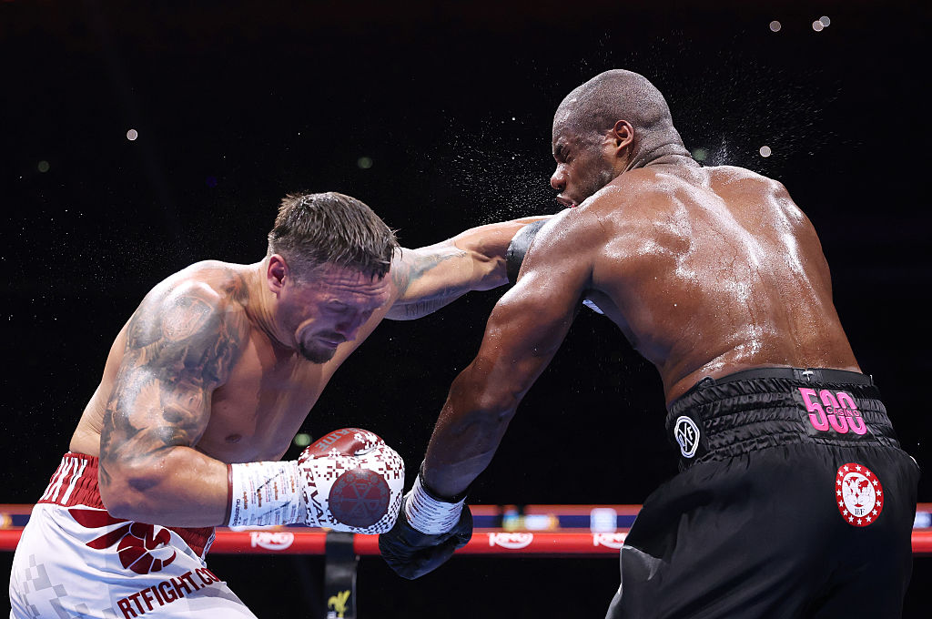 Oleksandr Usyk punches Daniel Dubois during their IBF, IBO, WBC and WBO World Heavyweight titles' fight on the 'Undisputed' fight night card at Wembley Stadium on July 19, 2025 in London, England.