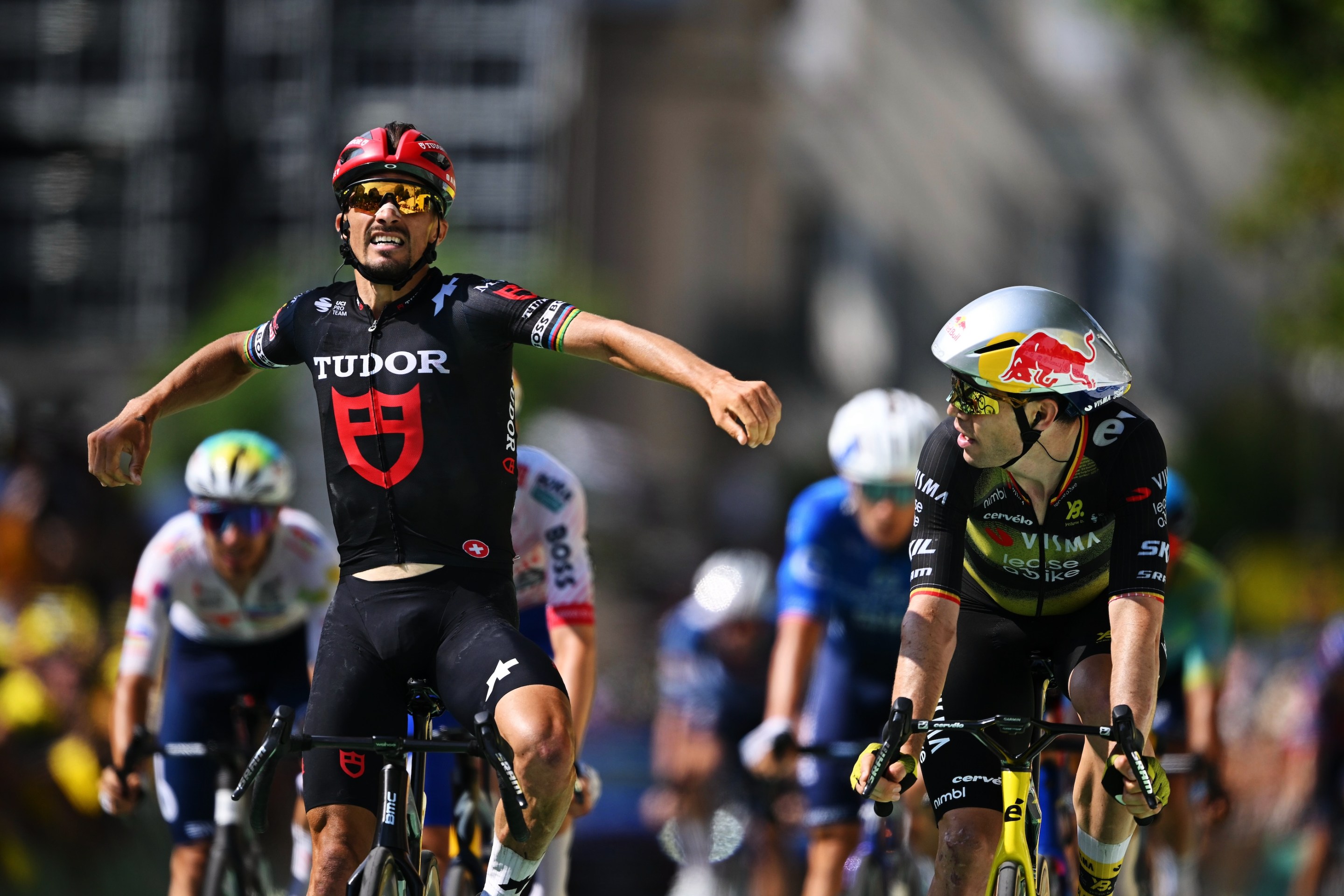 Julian Alaphilippe of France and Team Tudor Pro Cycling (celebrating wrongly) and Wout Van Aert of Belgium and Team Visma.