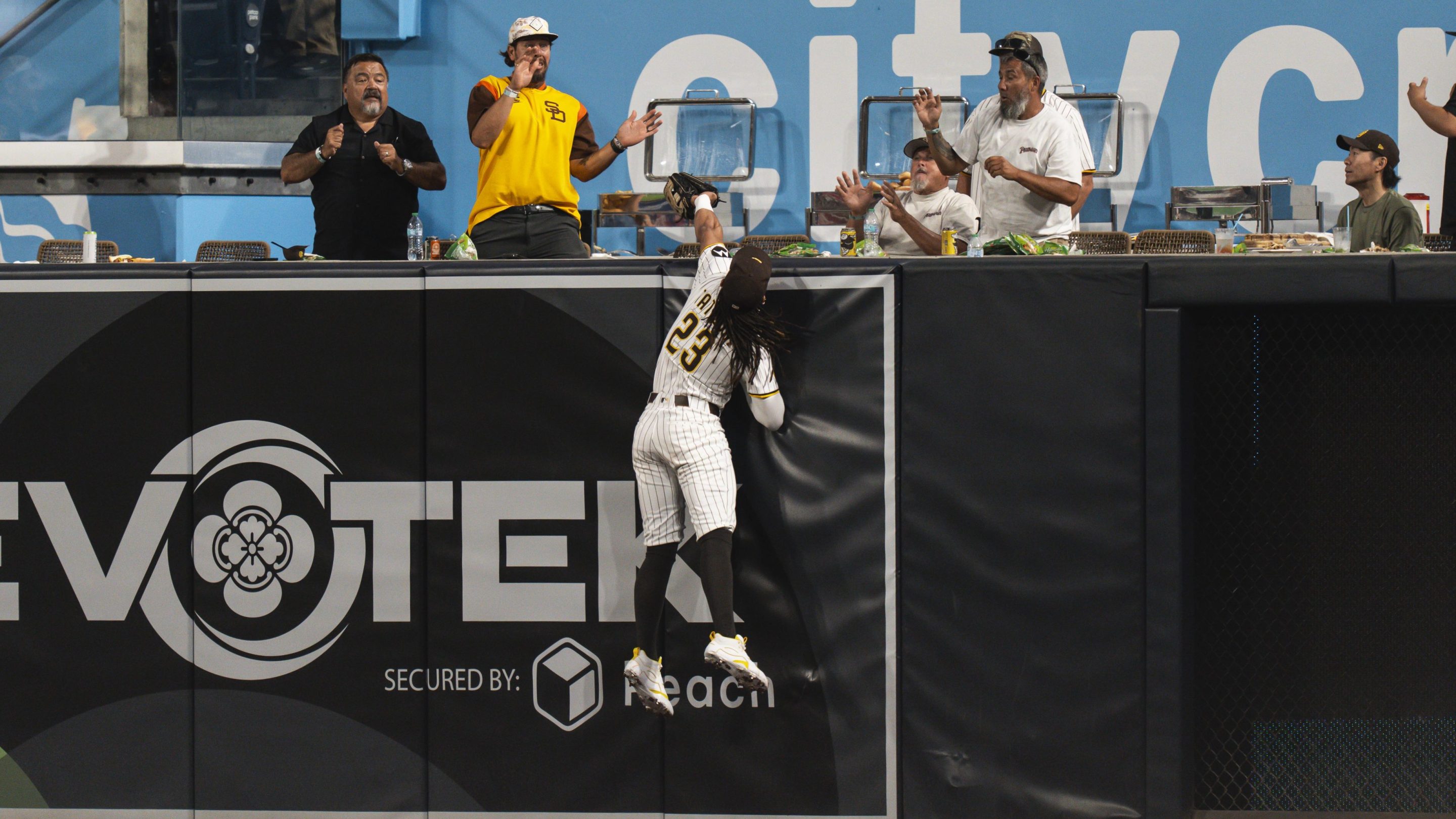 Fernando Tatis Jr. #23 of the San Diego Padres makes a jumping catch in the fourth inning of the game against New York Mets