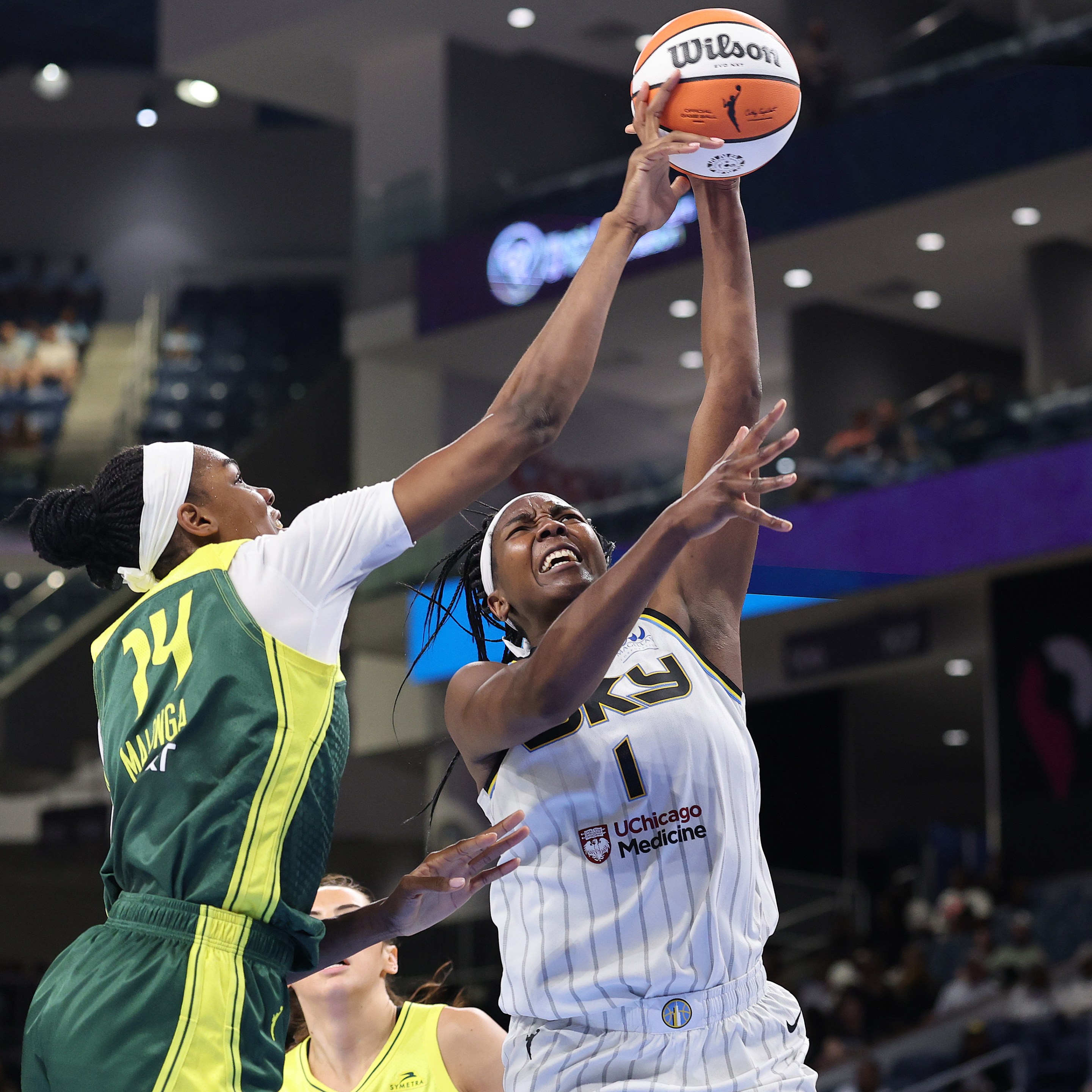 Dominique Malonga #14 of the Seattle Storm blocks a shot by Elizabeth Williams #1 of the Chicago Sky during the second half at Wintrust Arena on July 24, 2025 in Chicago, Illinois.