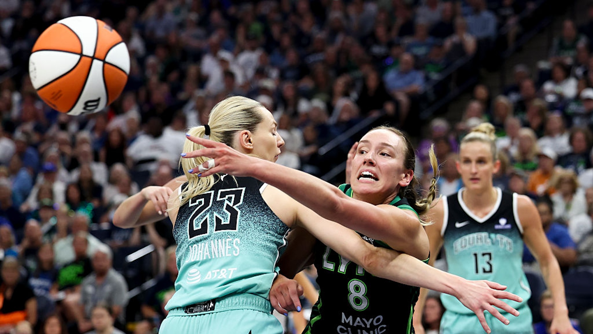 Alanna Smith #8 of the Minnesota Lynx passes around Marine Johannes #23 of the New York Liberty during the first quarter at Target Center on July 30, 2025 in Minneapolis, Minnesota. NOTE TO USER: User expressly acknowledges and agrees that, by downloading and or using this photograph, User is consenting to the terms and conditions of the Getty Images License Agreement.